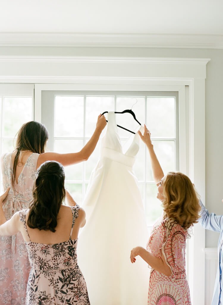 wedding-dress-hanging-window.jpeg