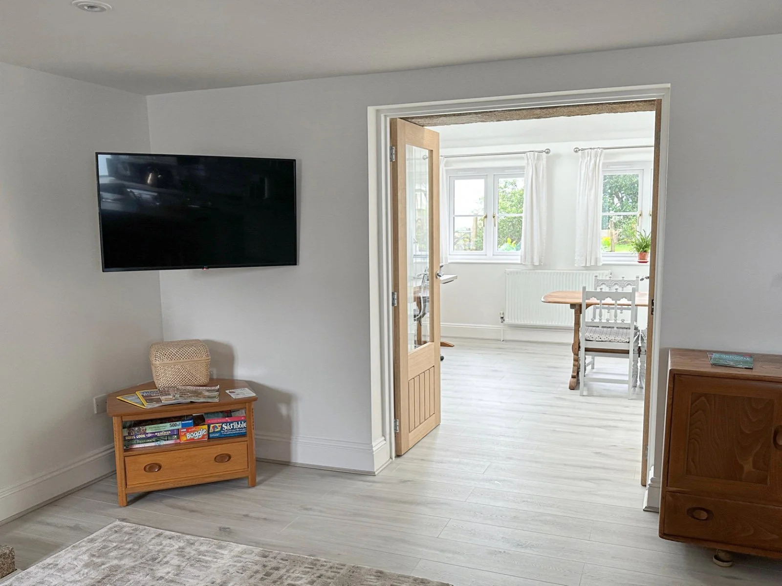 Lounge opens up into dining area with office working area.