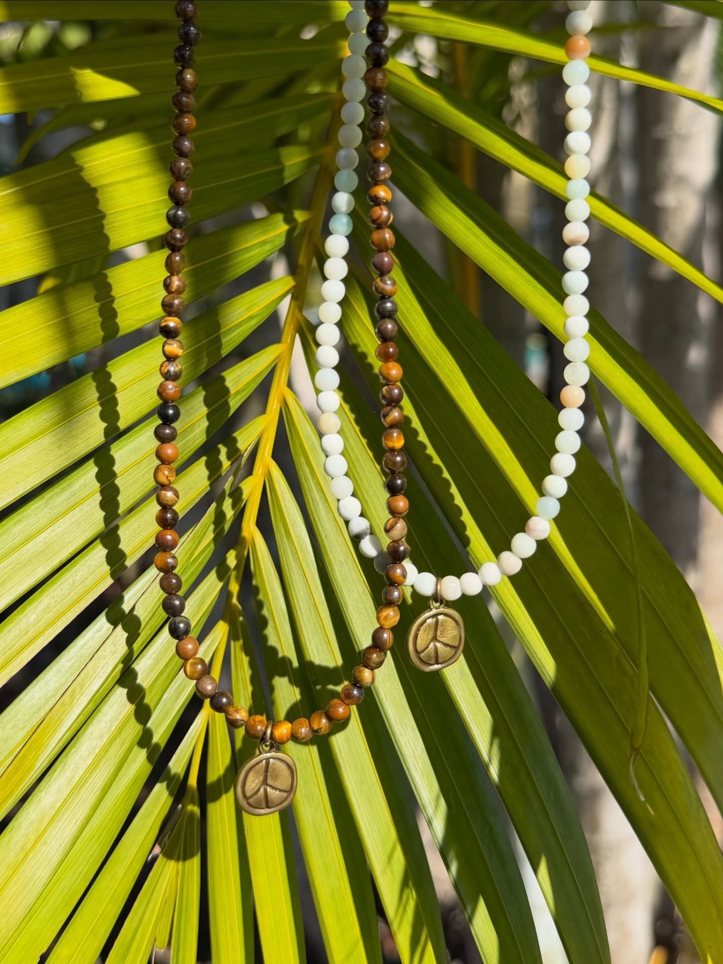 One Love beaded necklaces💛🌞 
✨ Tiger&rsquo;s Eye and Amazonite🌴 
✨ Part of our V-Day shop💘
Online at barefootcreations321.com
.
.
.
. #valentinesday #giftideas #giftsforher #handmadejewelry #shopsmall