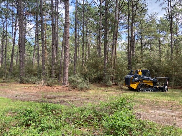 Louisiana Land Management team using equipment to clear land