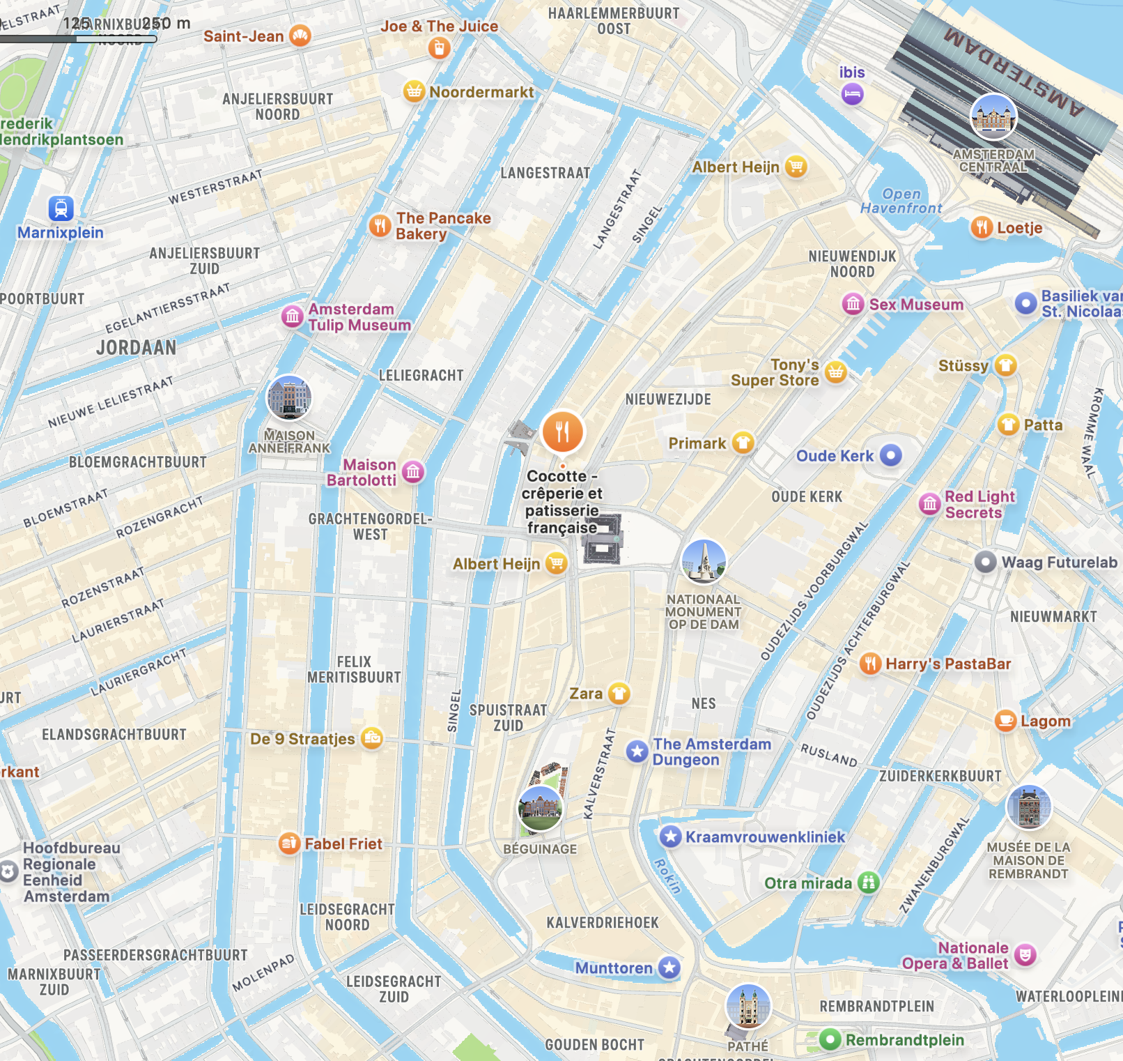 Map of Amsterdam showing landmarks such as the Amsterdam Central Station, Anne Frank House, Dam square and the Spuistraat with the famous Coco Cocotte restaurant .