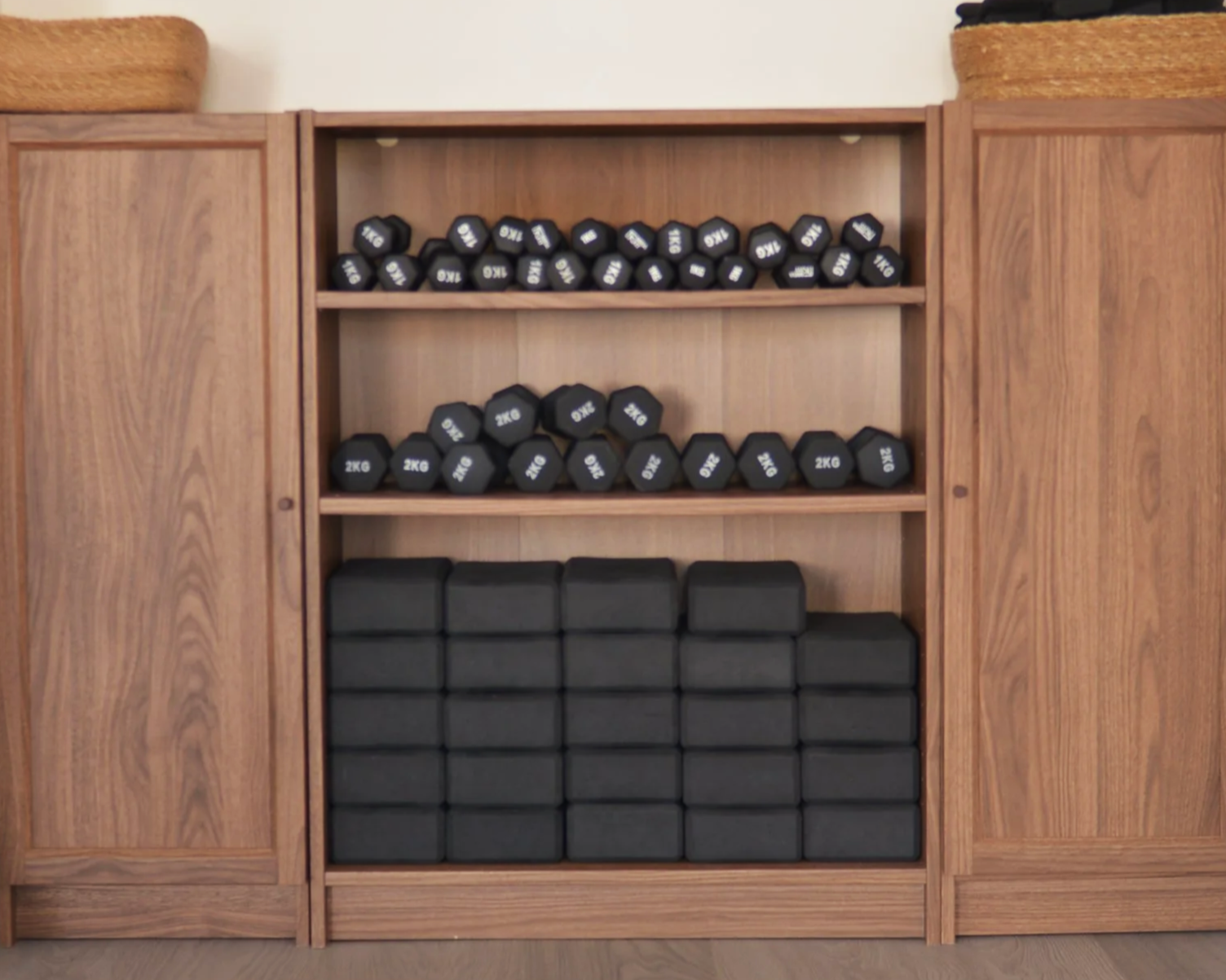 The equipment shelf in our studio space - we have 1kg and 2kg weights, Pilates balls, yoga blacks, Pilates rings, ankle weights and bands