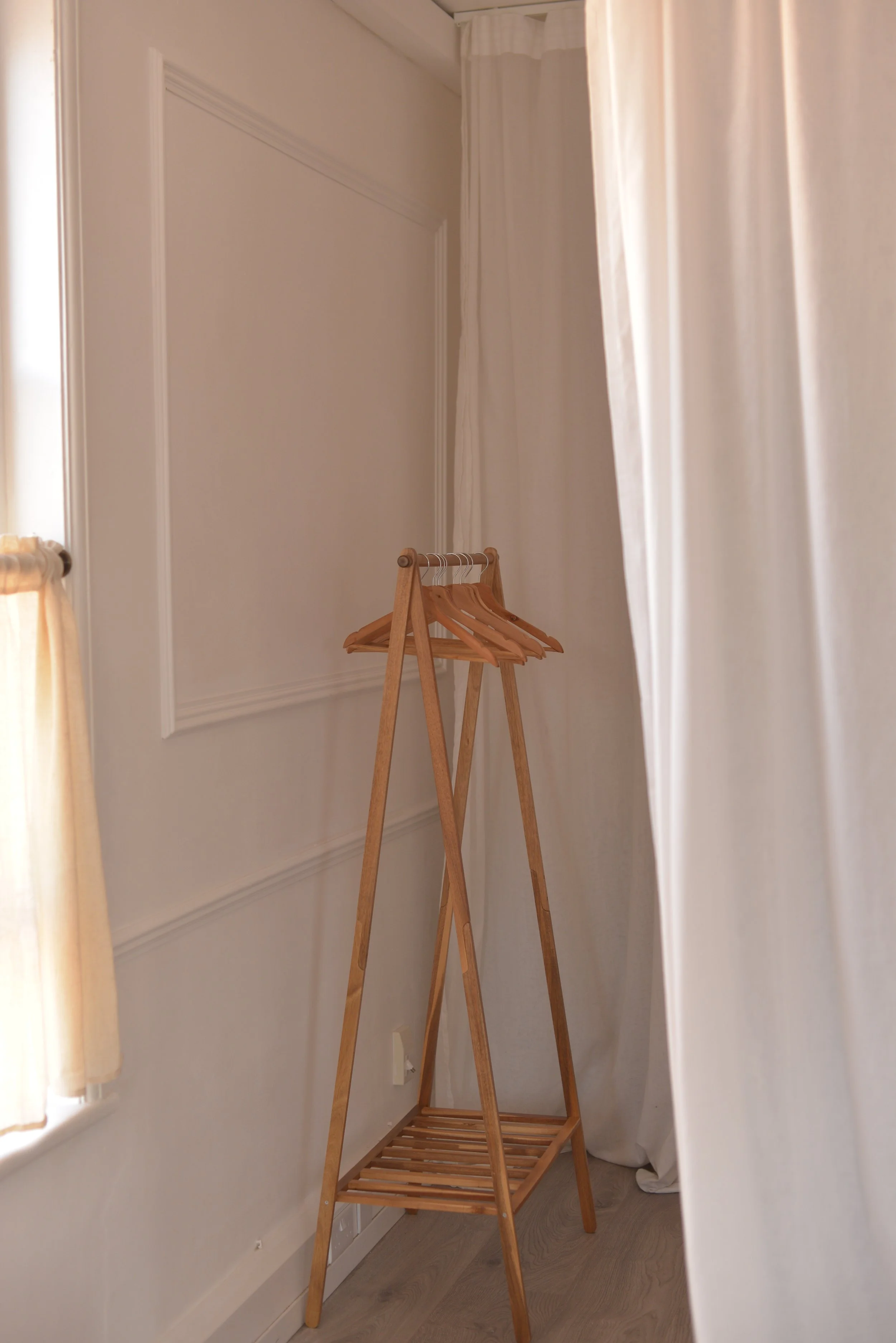 A coat rail at the entrance to the changing room