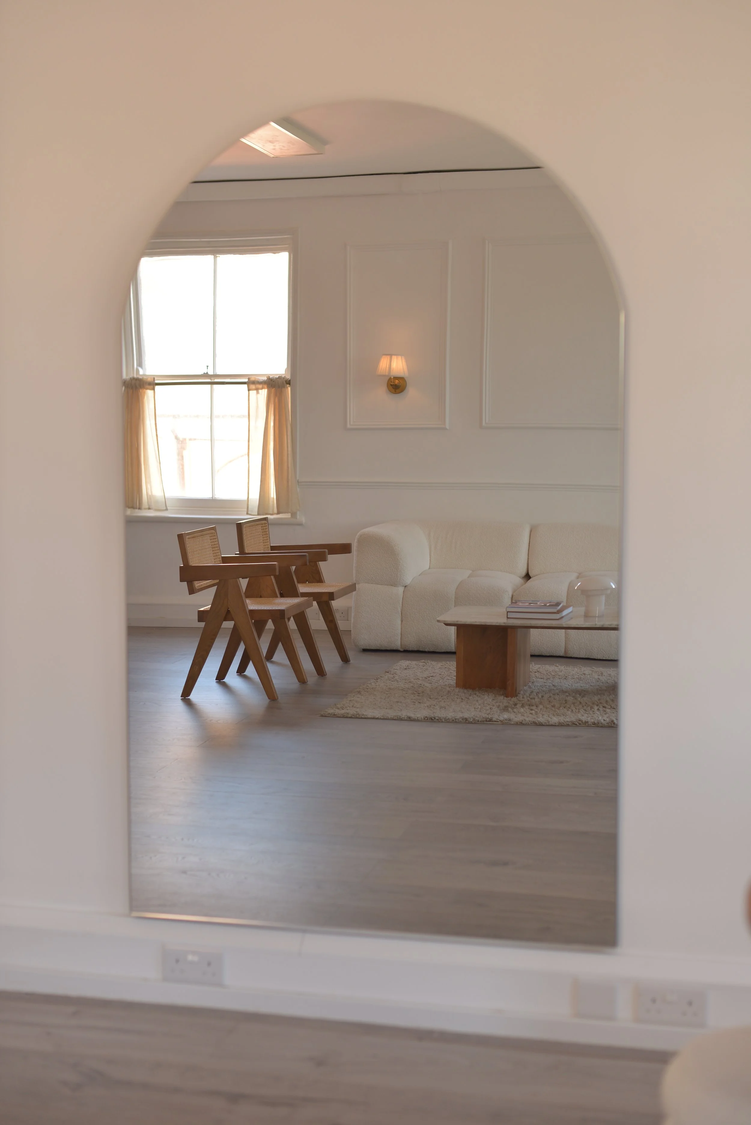 Arch mirrors throughout the space