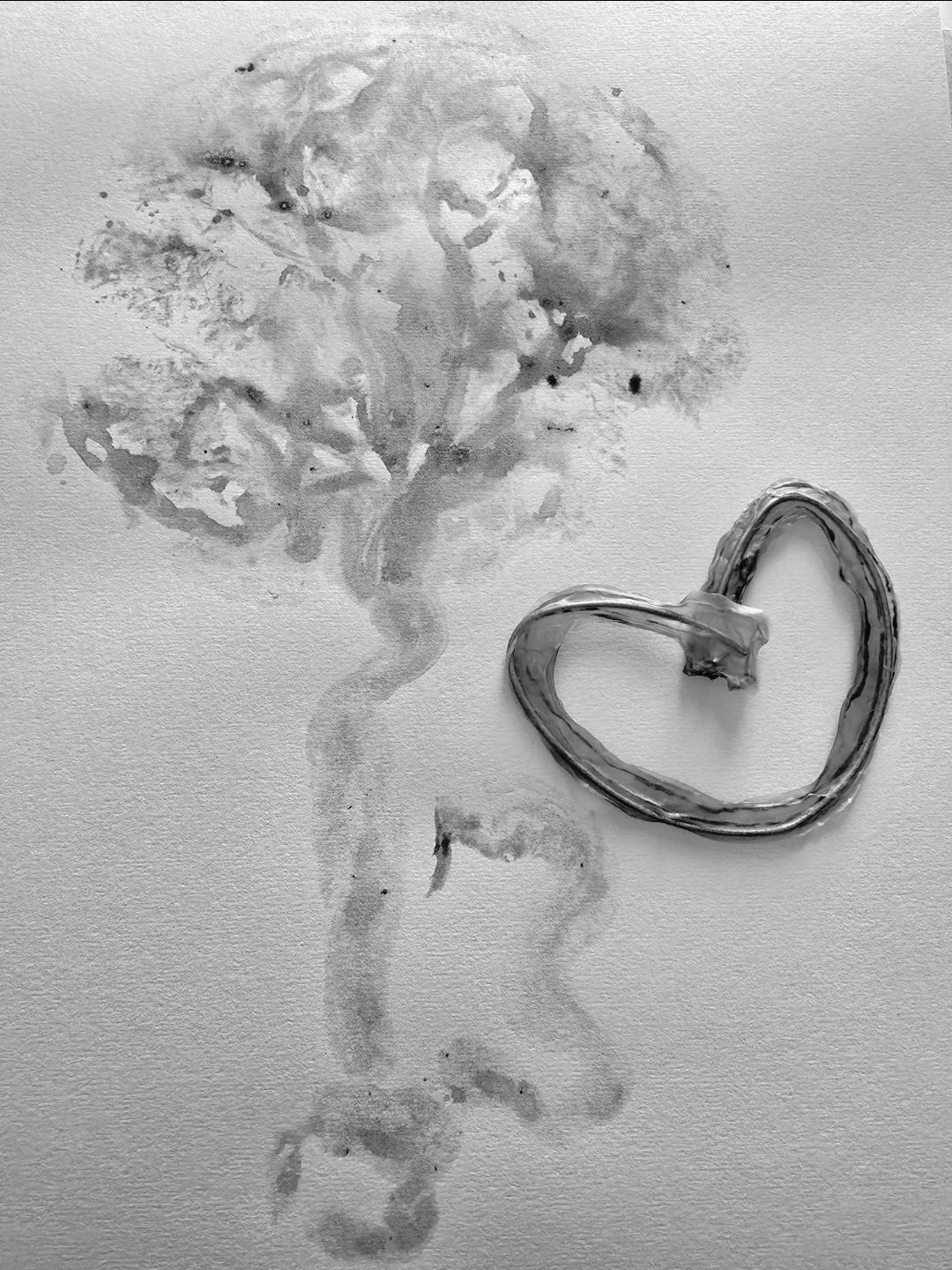 Watercolor painting of a tree with a heart-shaped bark on the right side.