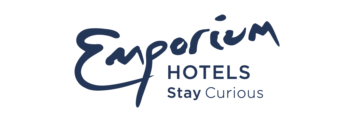 Logo of Emperor Hotels with the tagline "Stay Curious" in blue text.