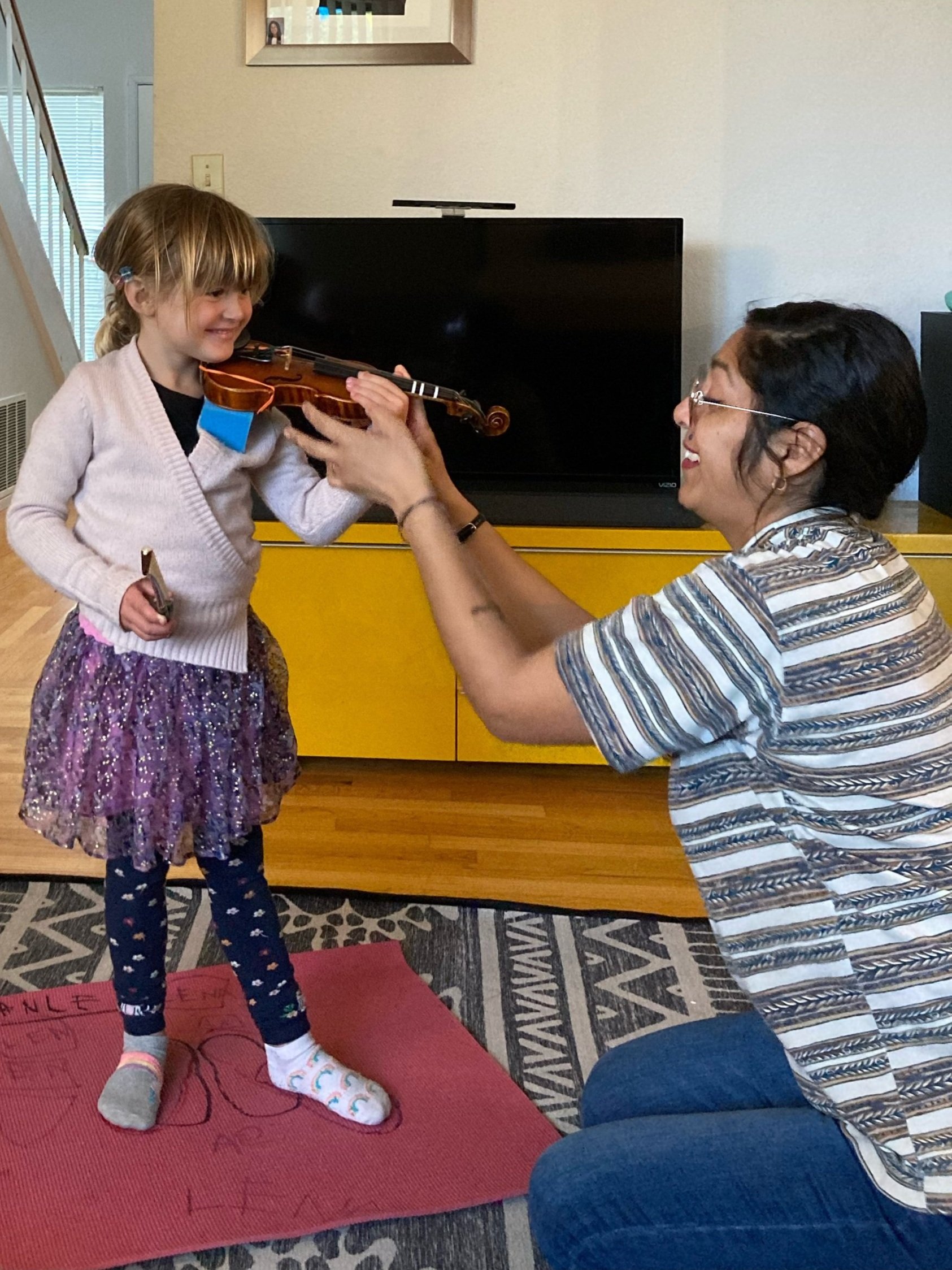 Rosa teaching a string lesson