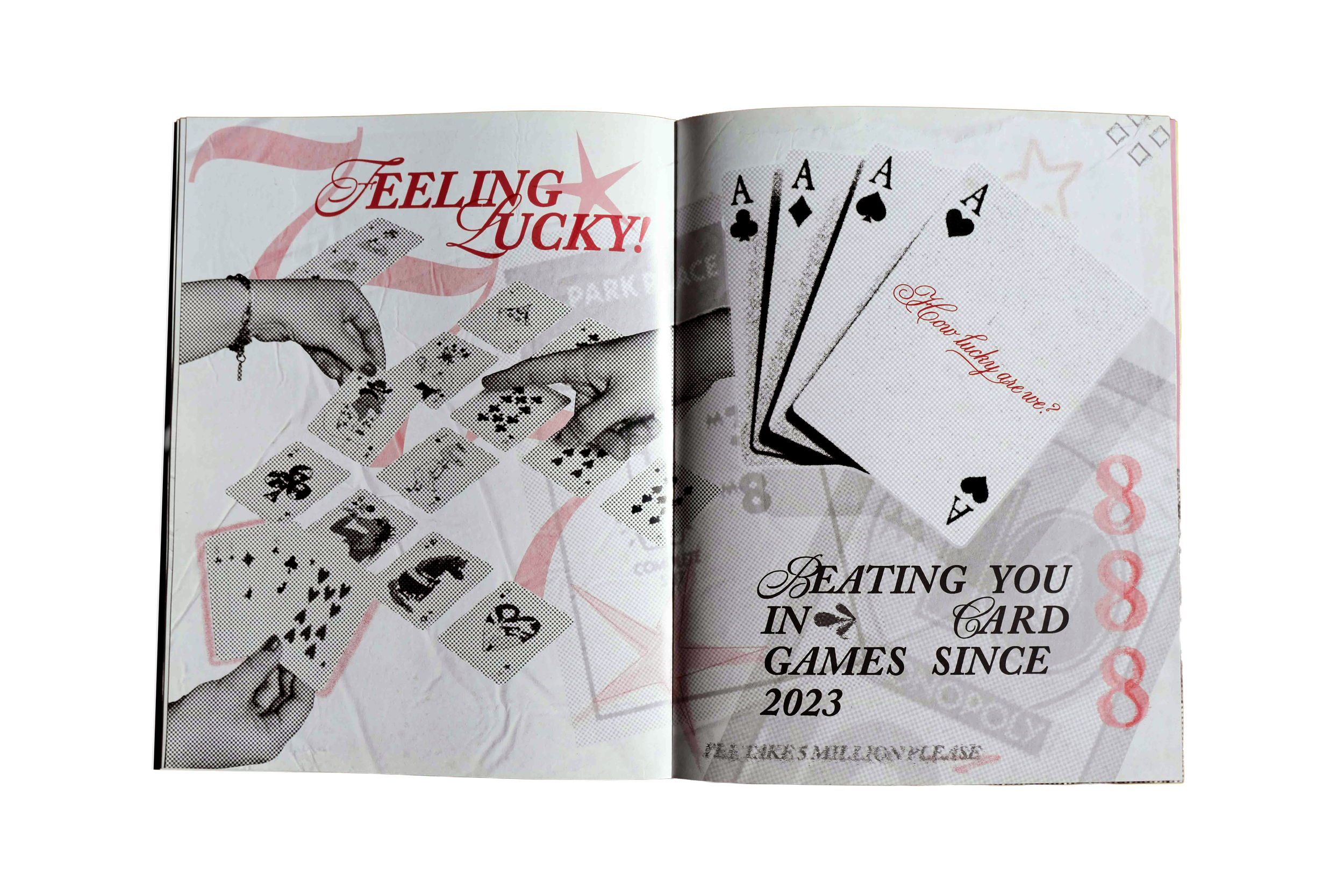 Open book with black and white playing cards, including aces, spread out on the right page, and the left page features the phrase 'Feeling Lucky!' in red text and an illustration of a hand holding cards.