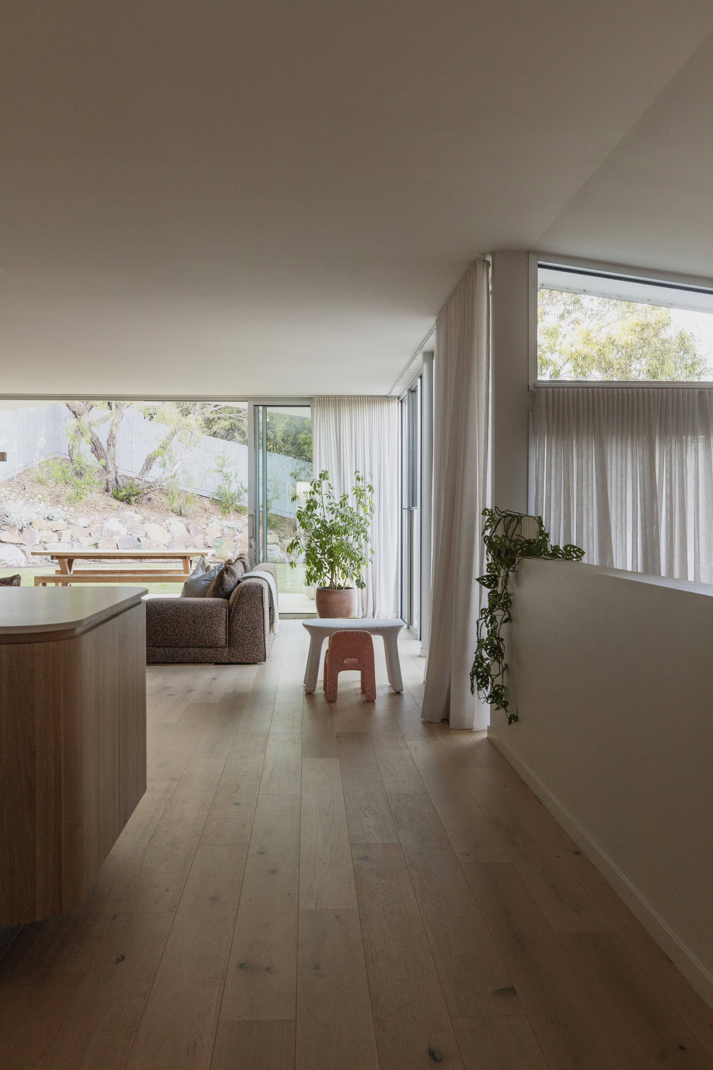 Build by Rawlinson, architecture by Pleaser Perkins. Living and dining area, bright open airy kitchen, outdoor living, kids furniture, sheer curtains.