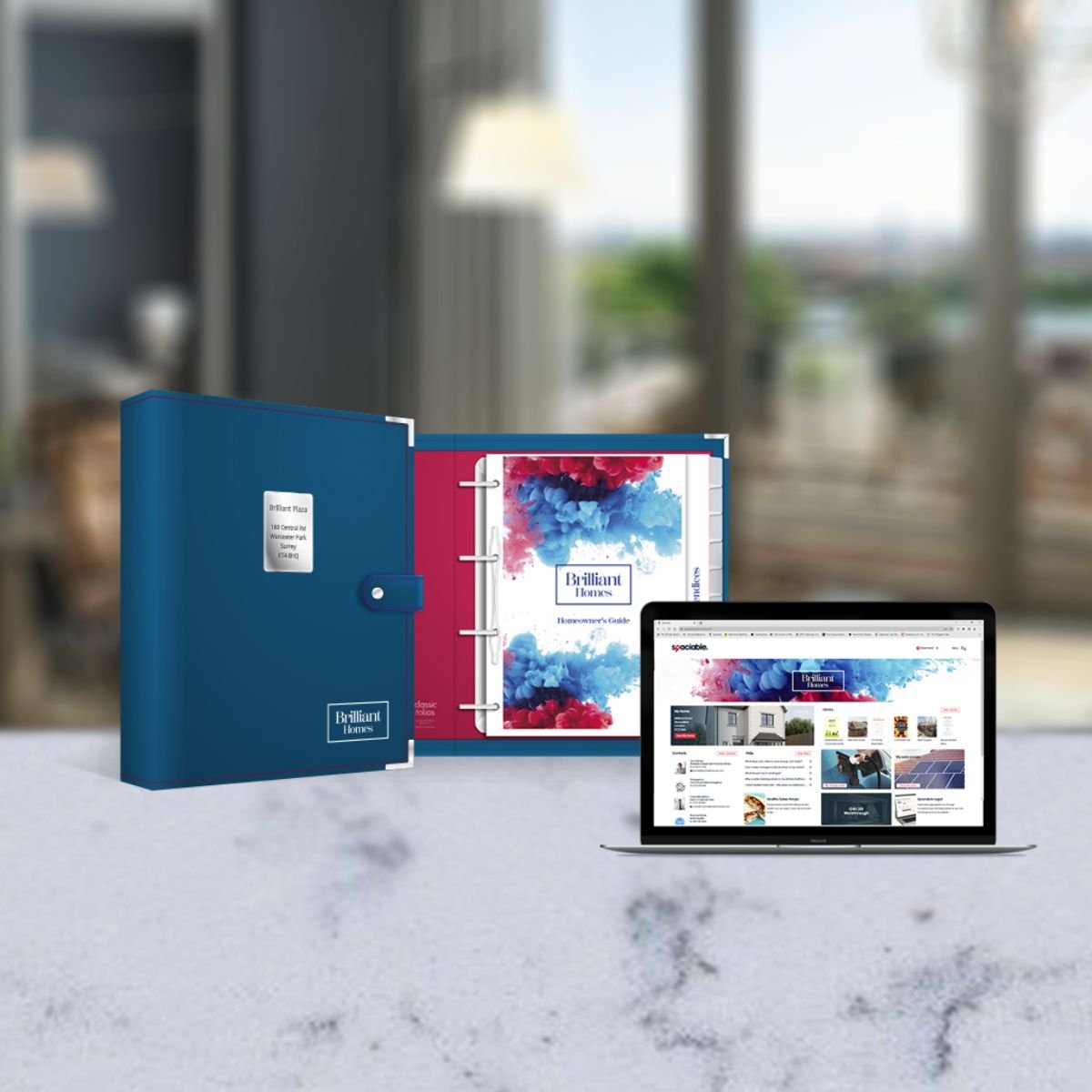 Table top displaying Classic Folios Home User Guide in bespoke folio and Spaciable portal with homebuilding company branding.