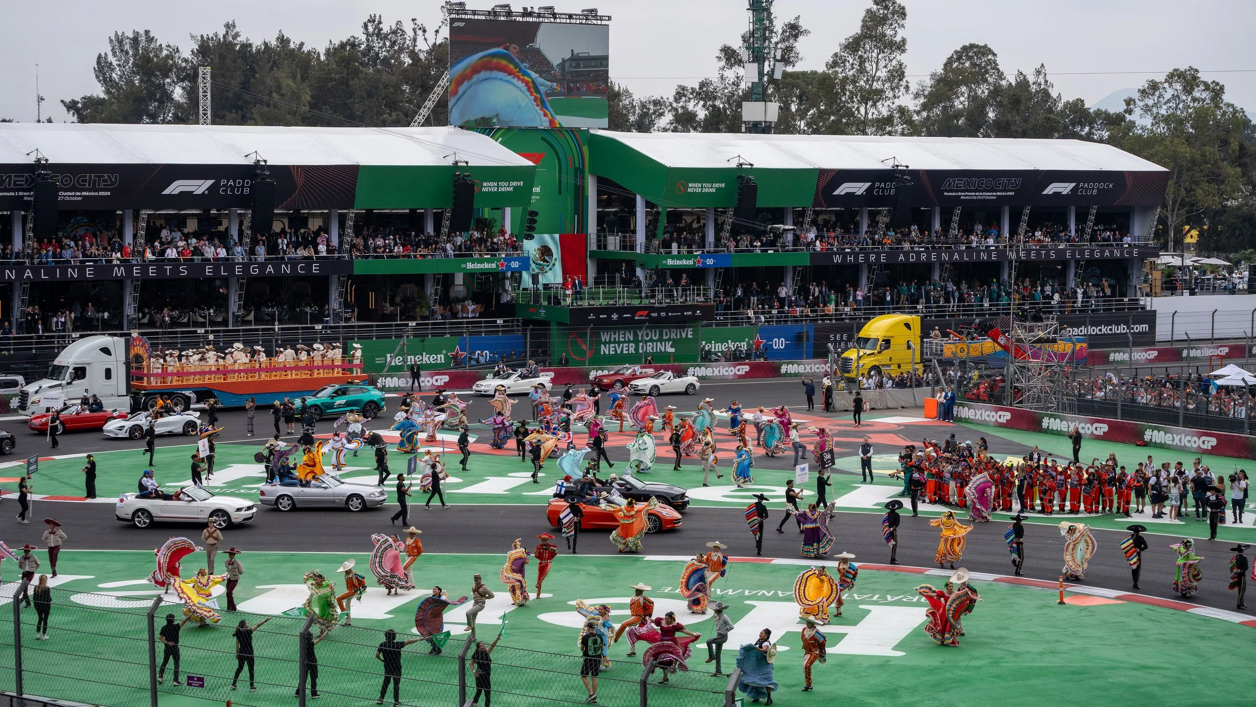 The Foro Sol stadium section at the Mexico City Grand Prix packed with fans waving Mexican flags