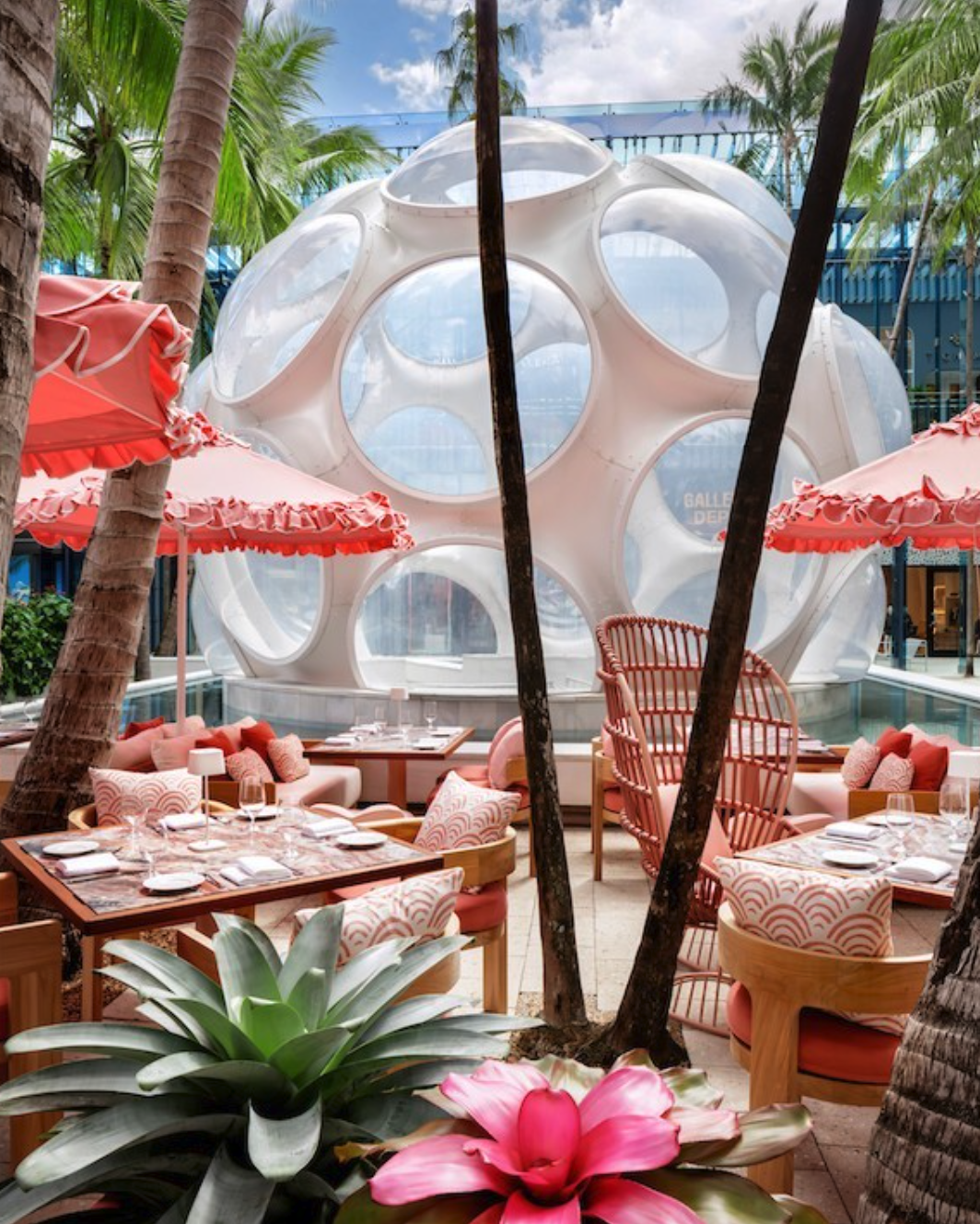 Outdoor patio at Sofia restaurant in Miami's Design District with the Buckminster Fuller Fly's Eye Dome in the background