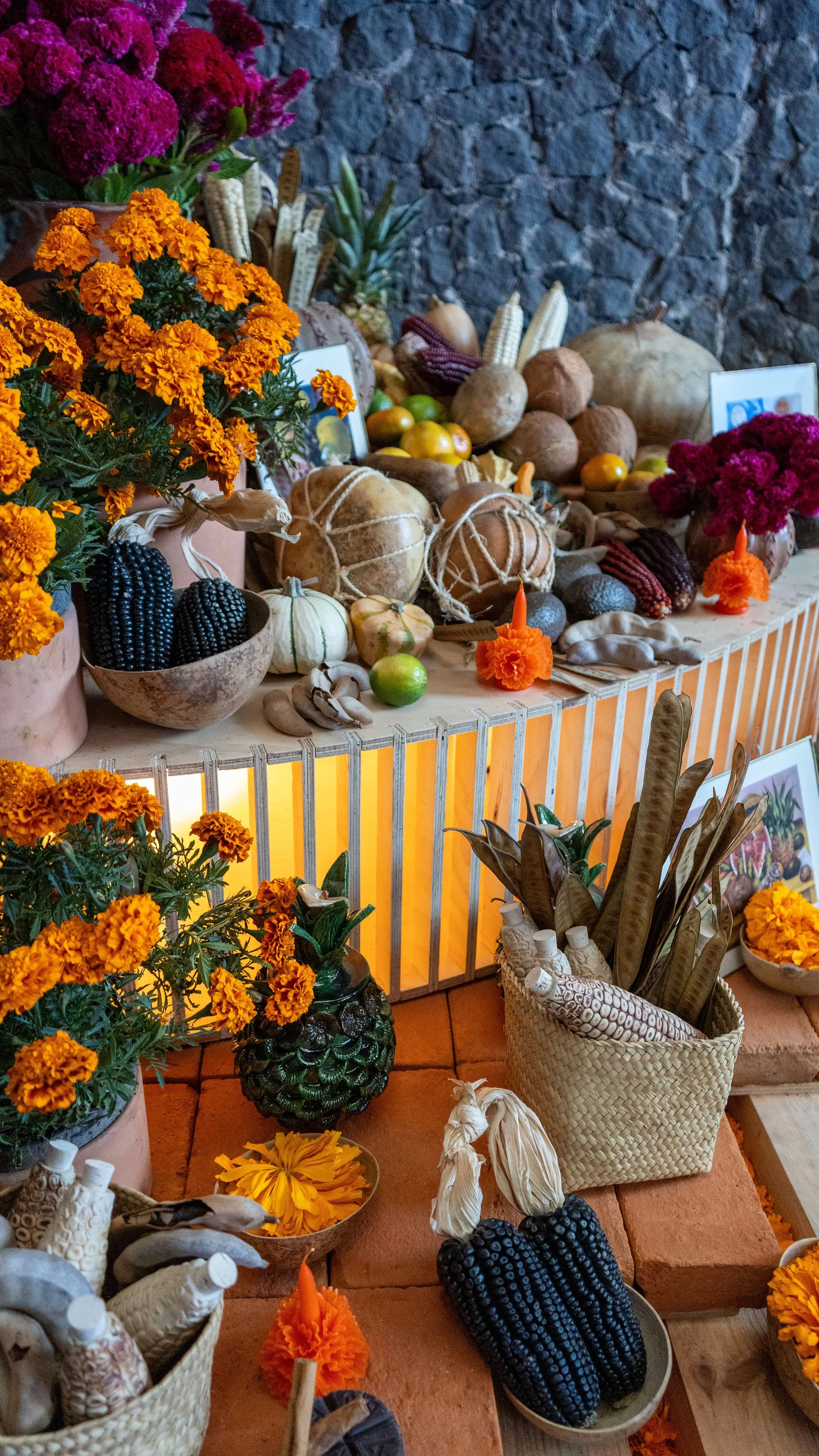 A colorful Día de los Muertos altar decorated with marigolds candles and sugar skulls in Mexico City