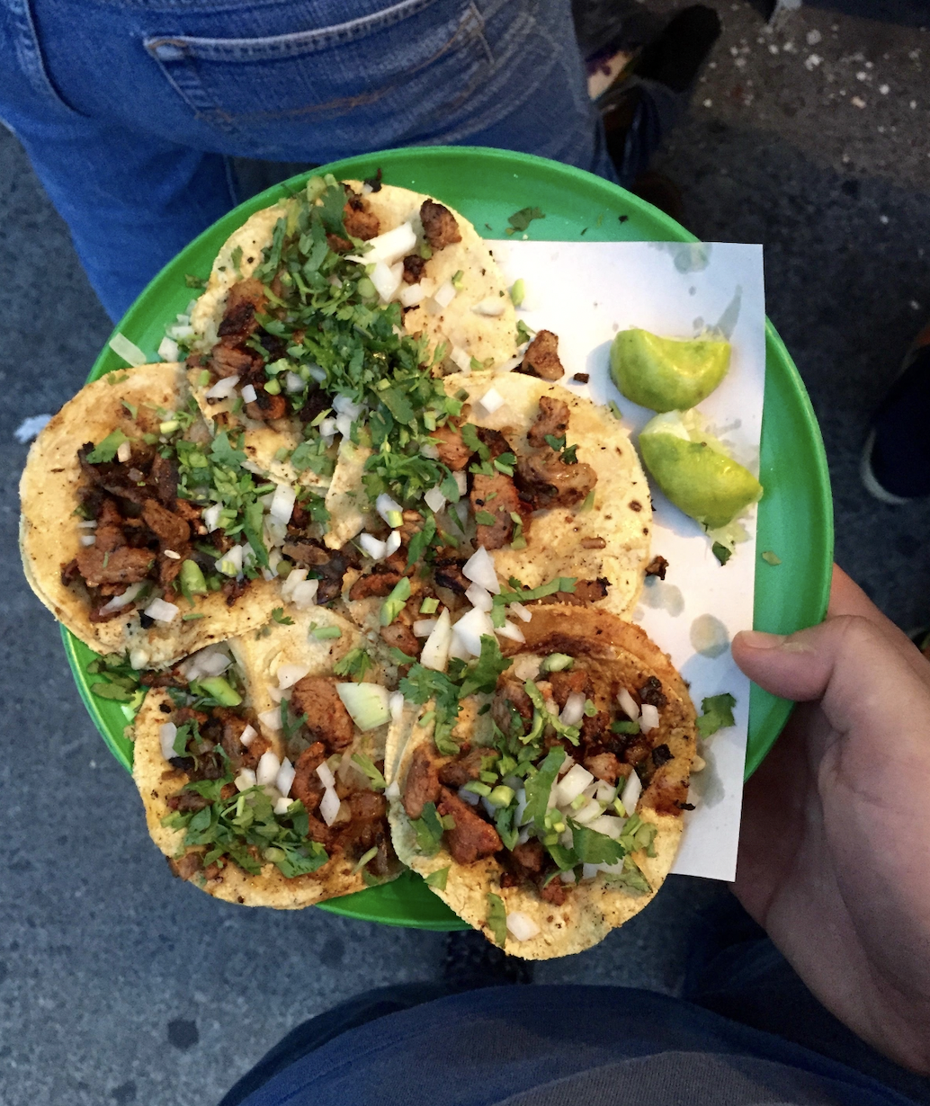 Authentic Mexico City street tacos al pastor served on small corn tortillas with pineapple cilantro and lime