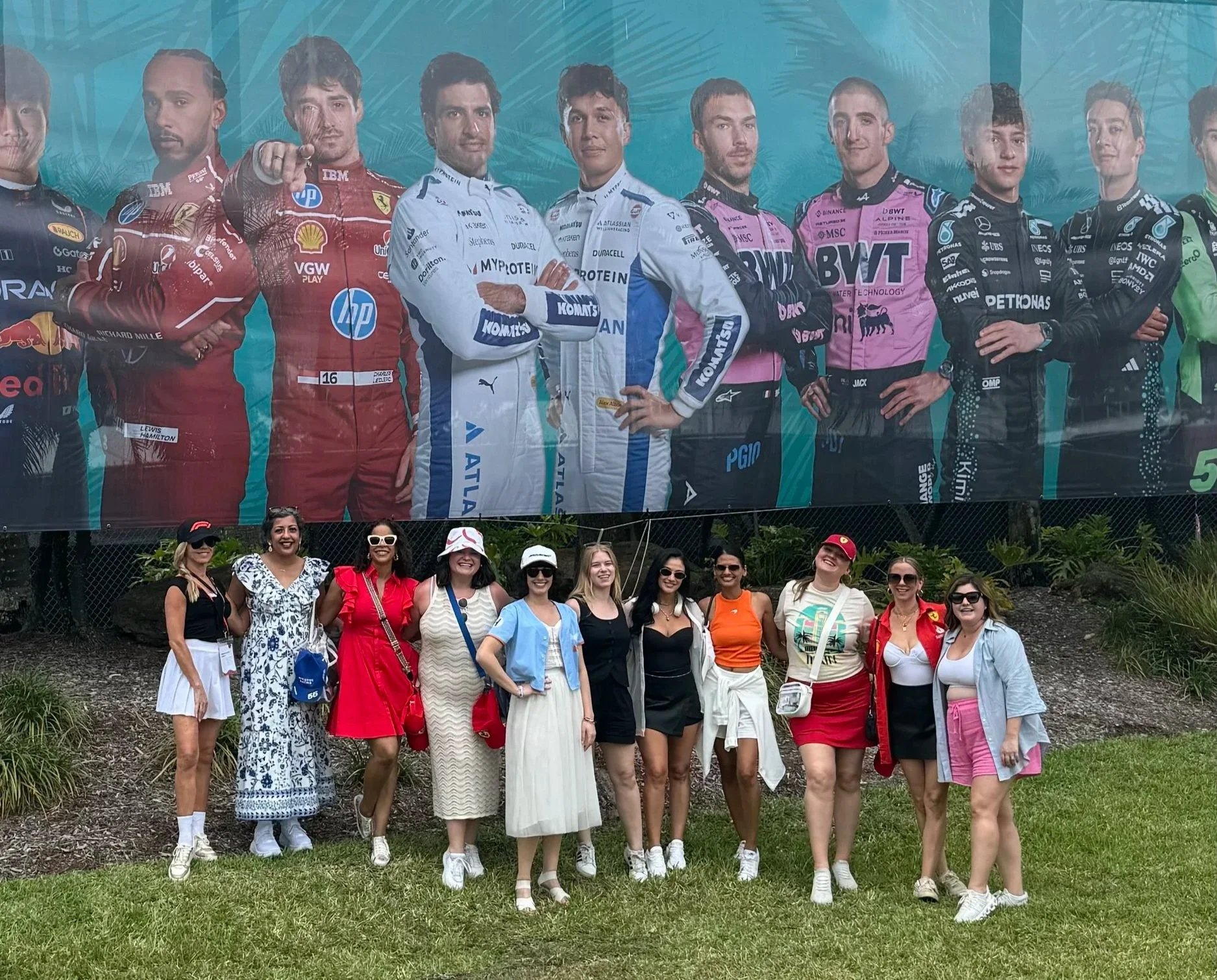 Group of OTTR guests smiling together at the Miami Grand Prix