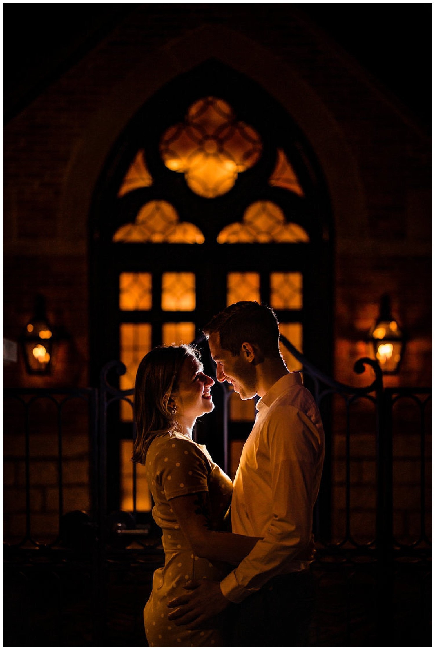 Cinematic Engagement Photo at Night in Front of Historic St Mary's Schoolhouse in German Village