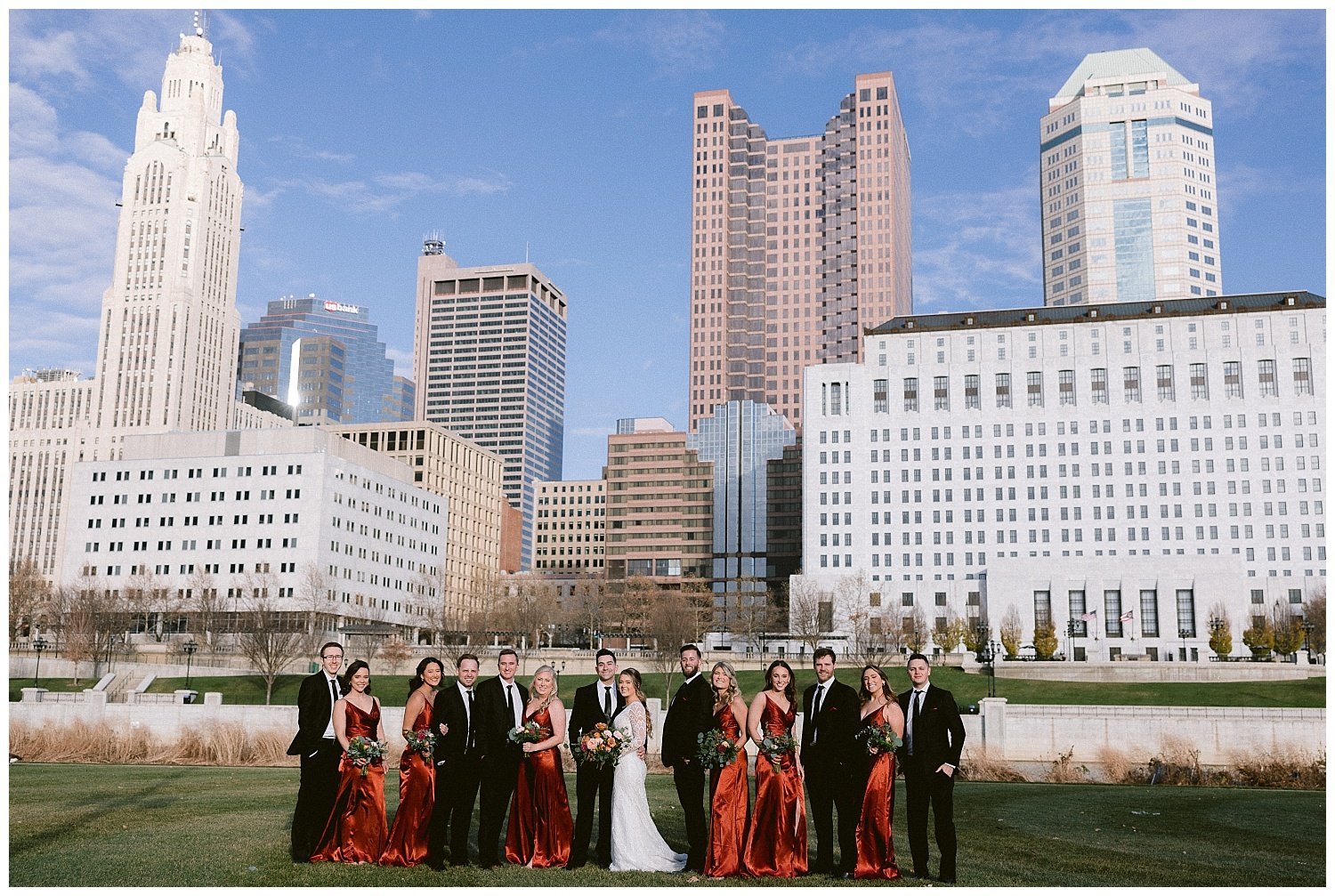 A wedding couple downtown Columbus with their bridal party.