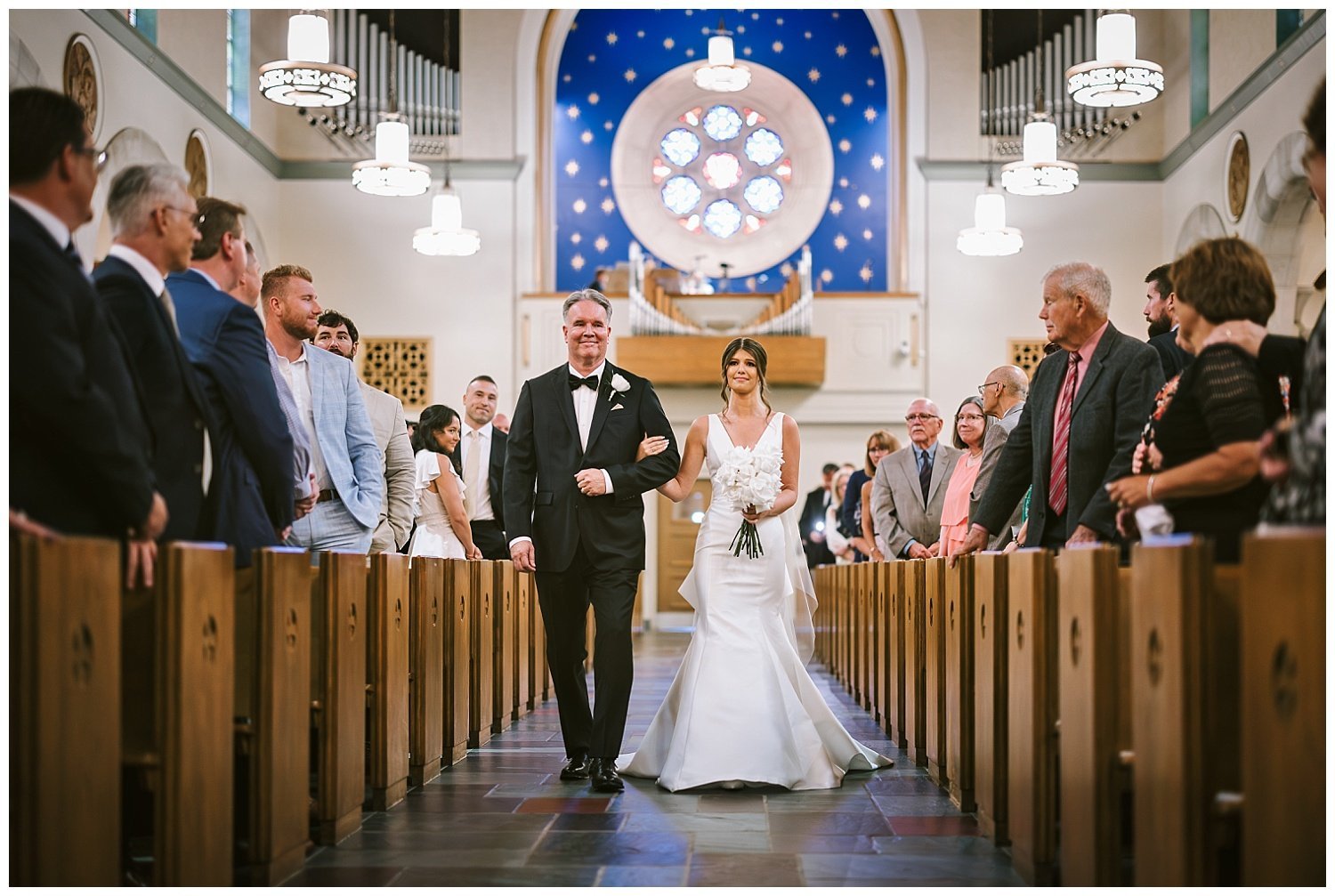 A bride and her father walking down the isle at St Michael's Church in Worthington, Ohio. 