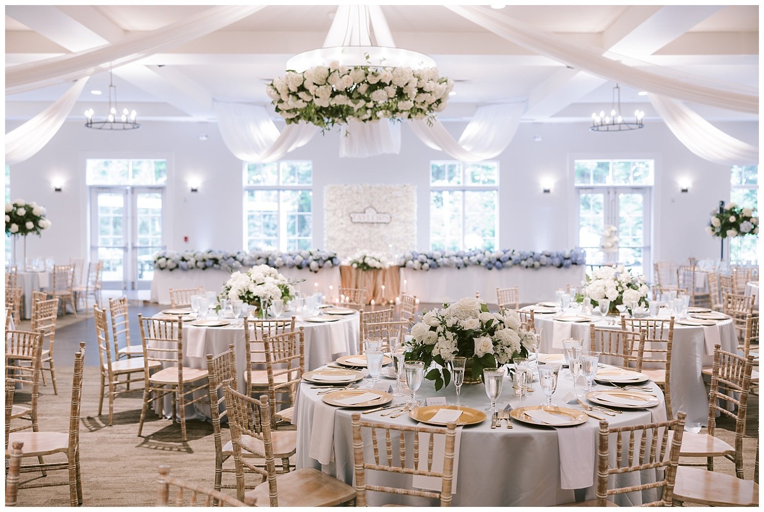 A beautifully decorated room with white florals and details at the Estate wedding venue in New Albany, Ohio. 