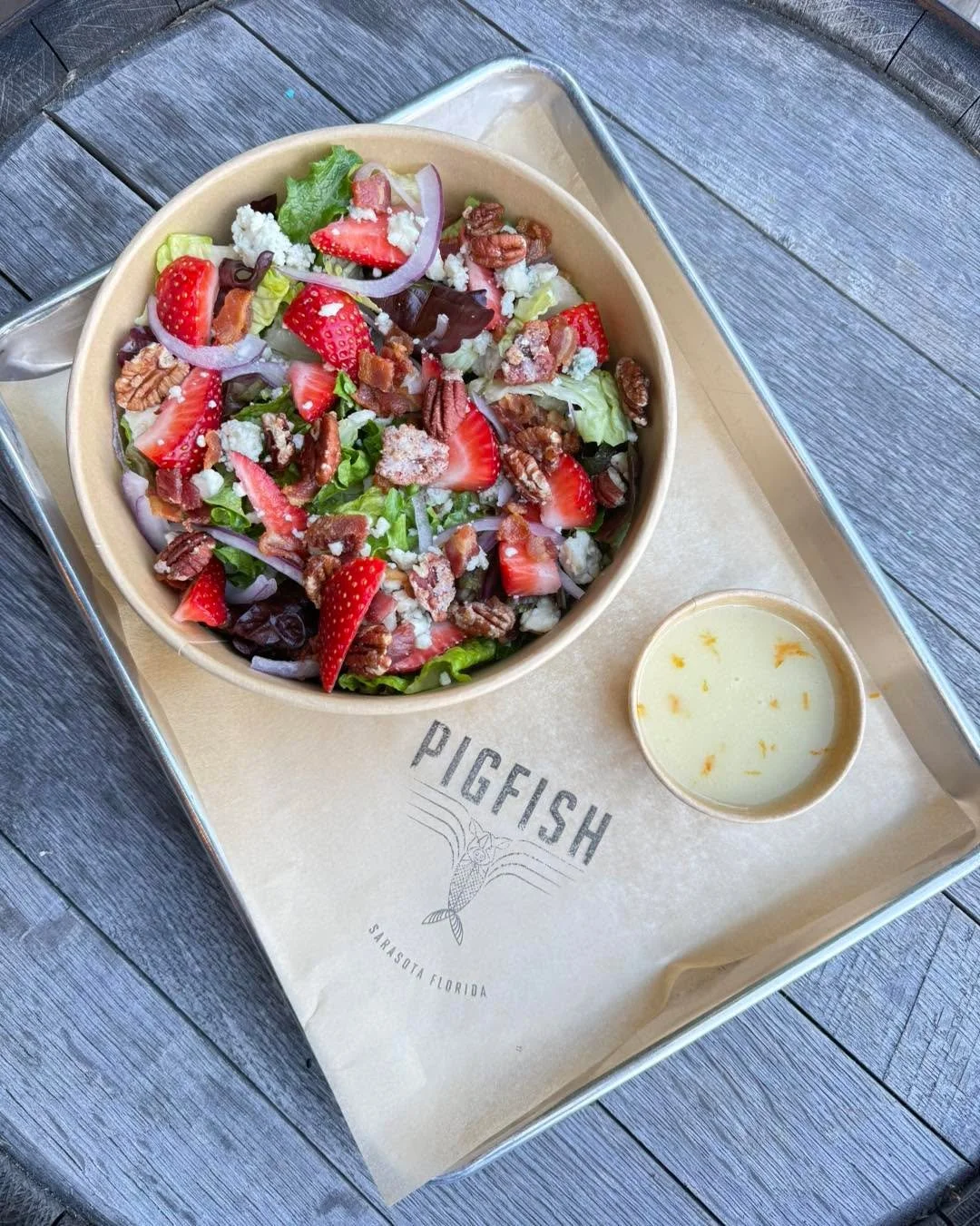 The strawberry salad 🥗 🍓

Seasonal Florida strawberries paired with crisp greens, candied pecans, blue cheese, cucumber, cheshire bacon, red onion, and a white balsamic citrus vinaigrette.

Available for a limited time! 

#salad #pigfish #sarasota 