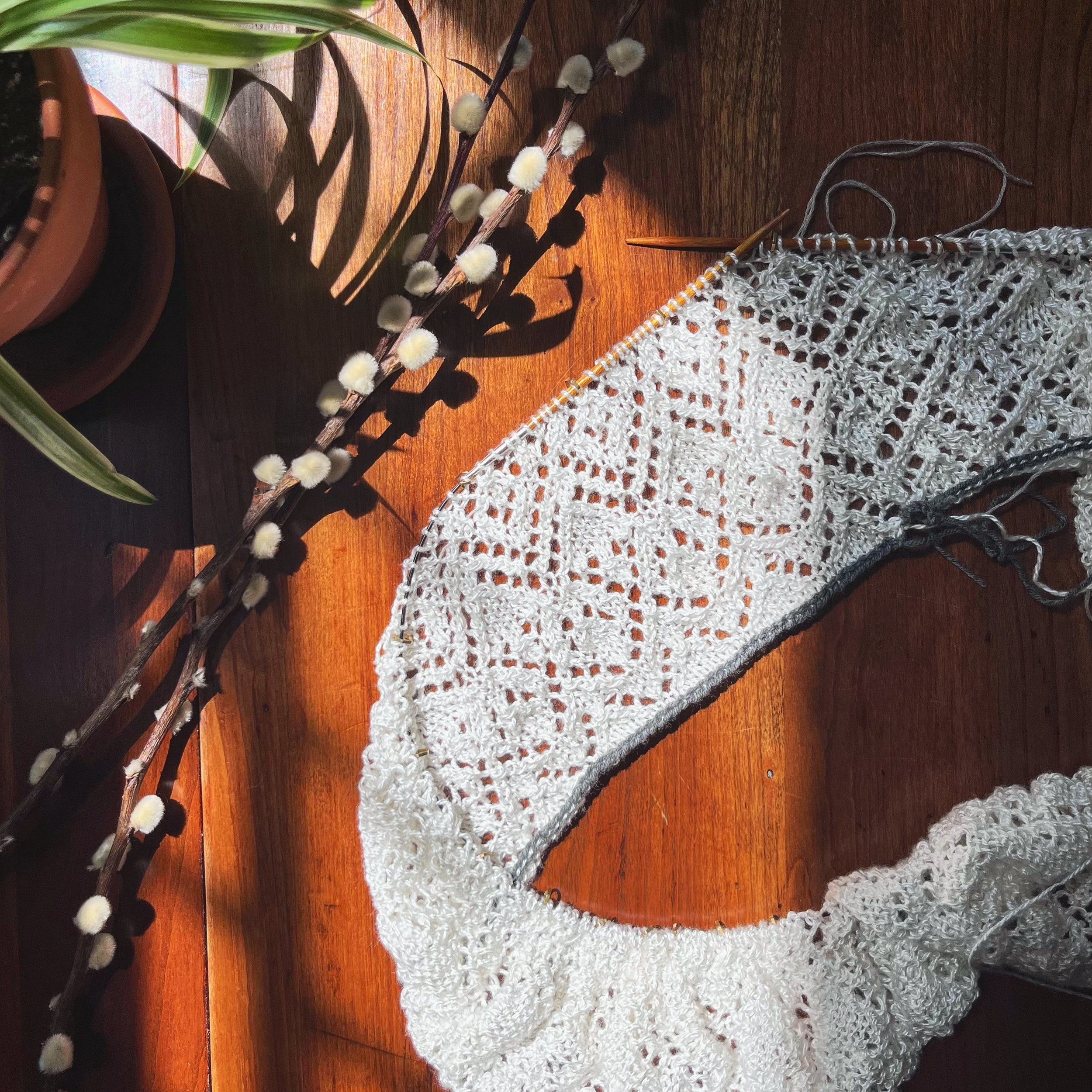 Completing the first few repeats of the first lace charts. The gray yarn shown on the edge is scrap yarn (leftover from my Tavia Skirt!) for a provisional cast-on, allowing me to pick up those stitches later to knit an enclosed waistband and top.