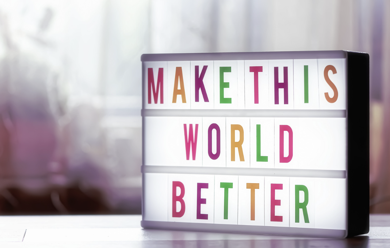 make this world better - sign showing how hate crime reporting can positively impact society
