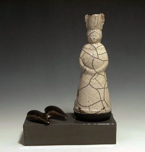 Fallen, slip cast and raku form, slip cast wings hand-built box electric kiln fired.