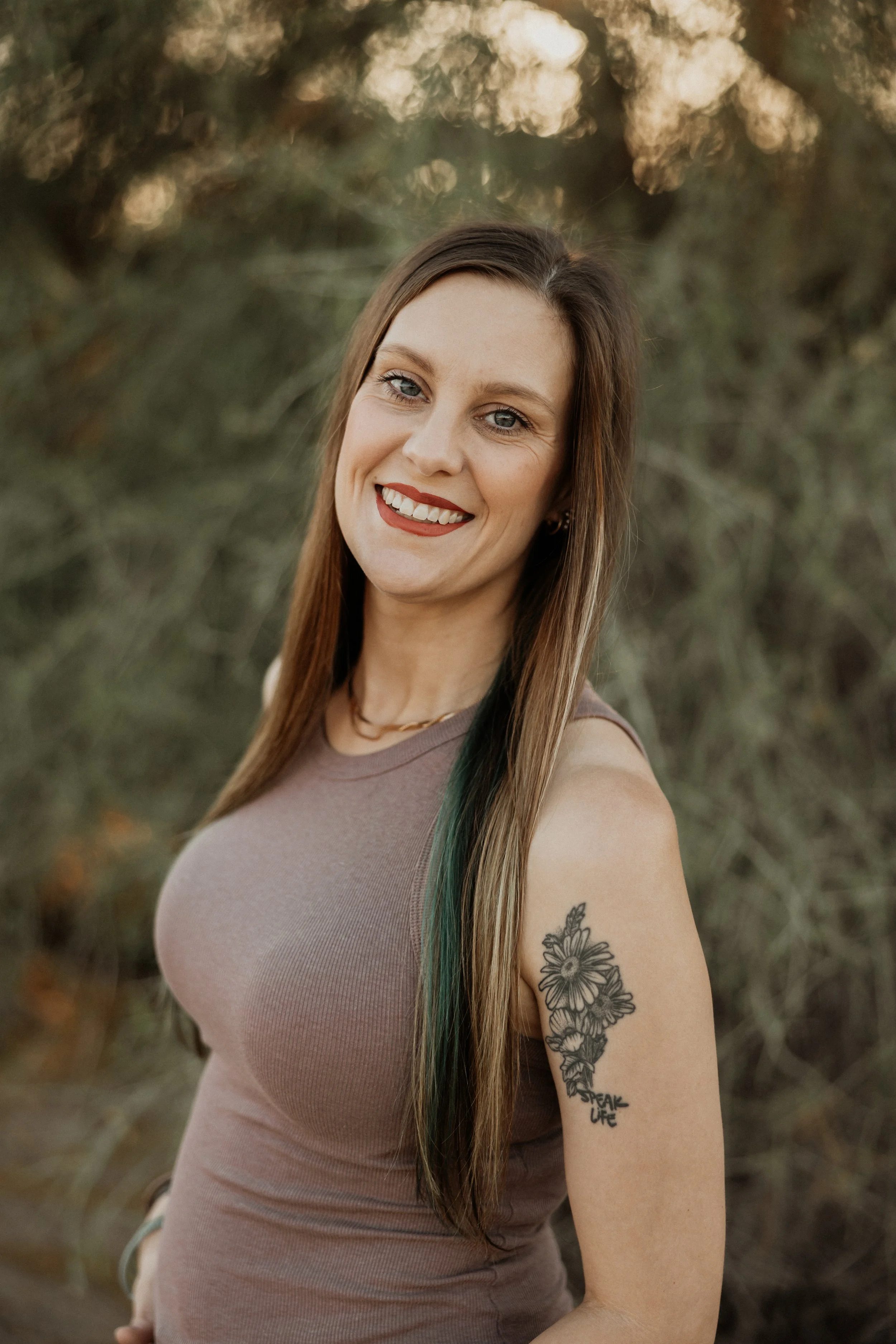 Professional headshot of an automotive marketing specialist smiling outdoors, helping auto repair and diesel shops improve their online presence, social media marketing, Google visibility, and customer trust.