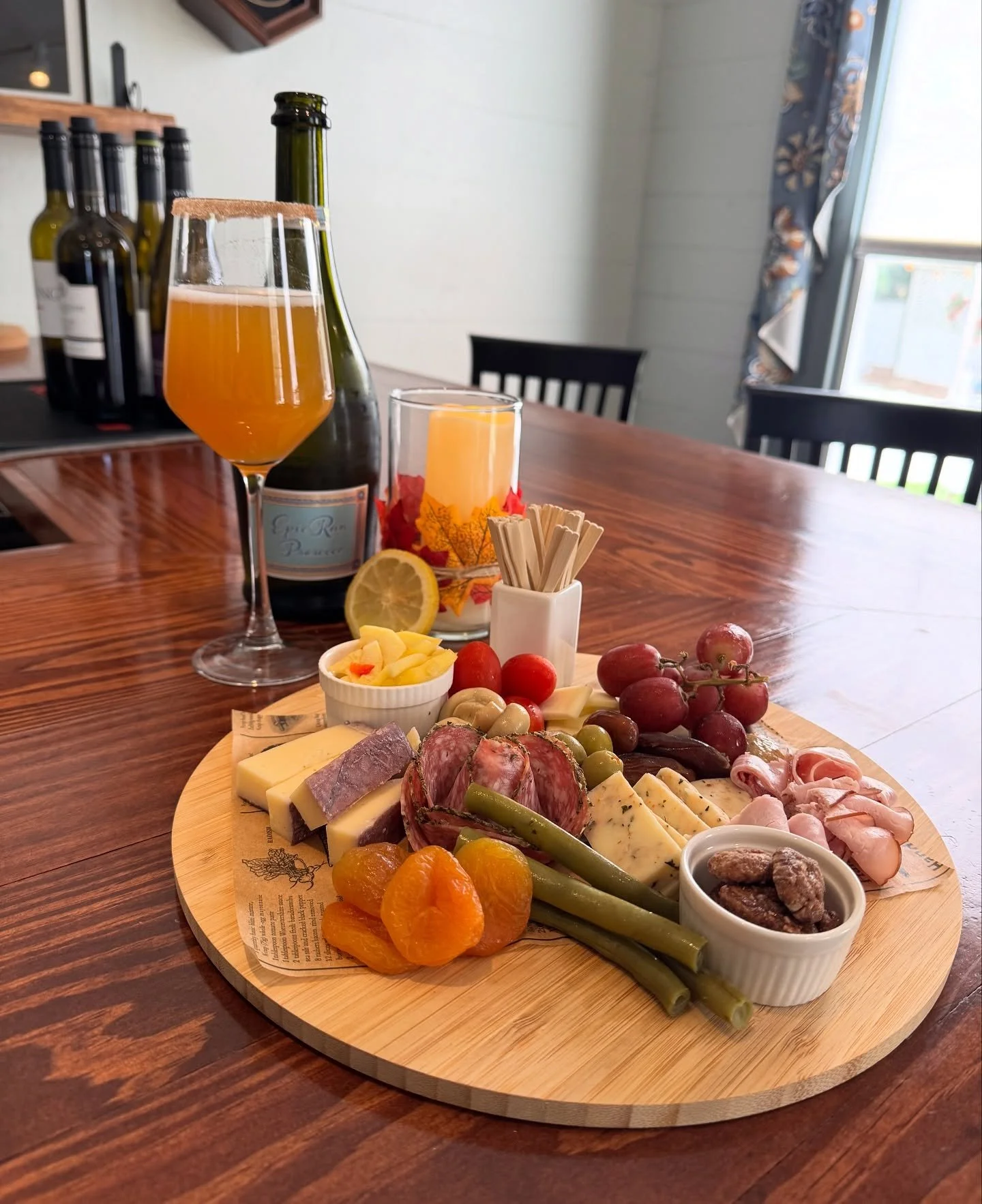 Charcuterie board with a momosa and snacks at The Boland House wine and event experience