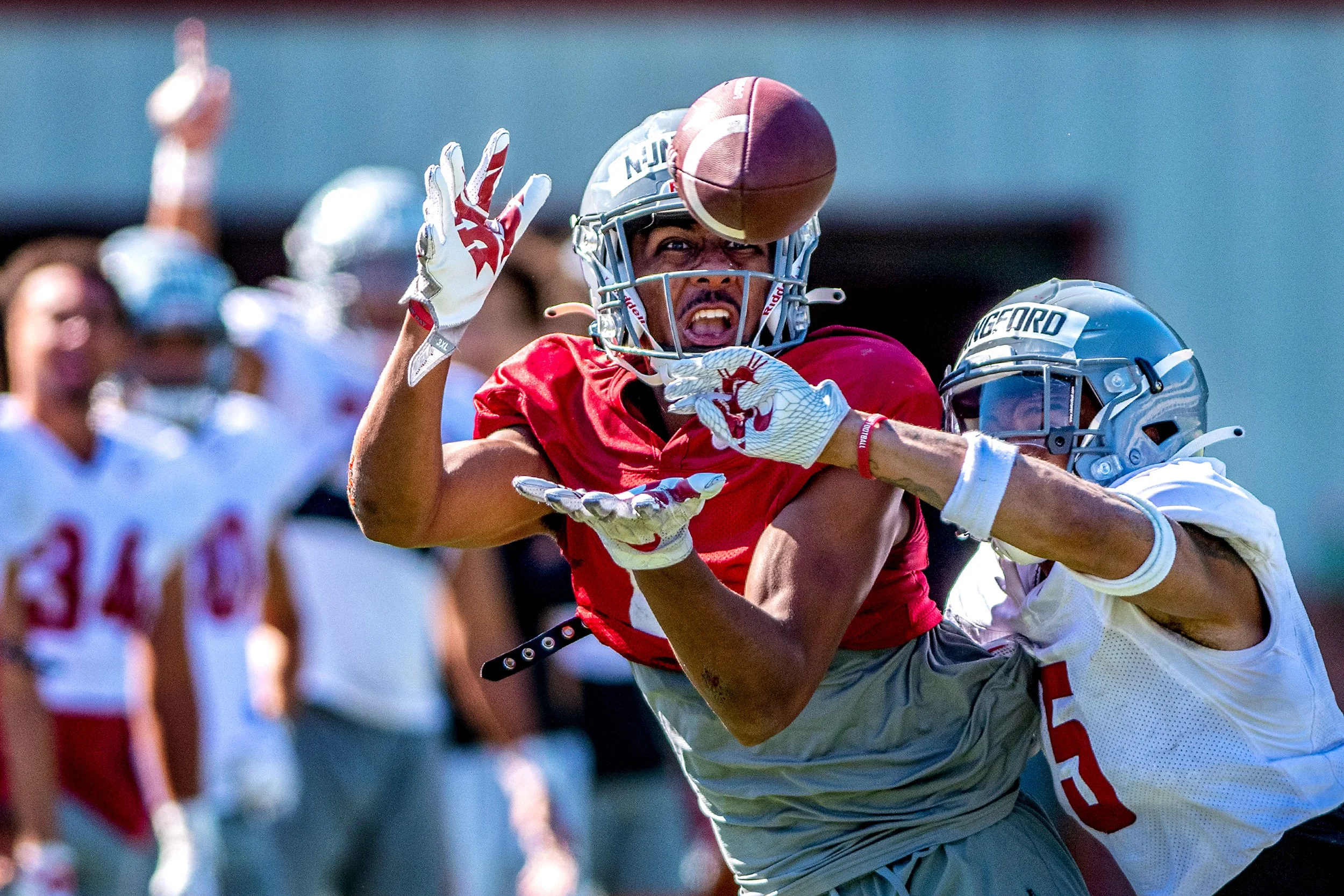 Washington State defensive back Derrick Langford Jr., right, successfully knocks down a pass intended for redshirt freshman wide receiver Tsion Nunnally on Aug. 6, 2022, during practice at Rogers Field in Pullman, Wash.