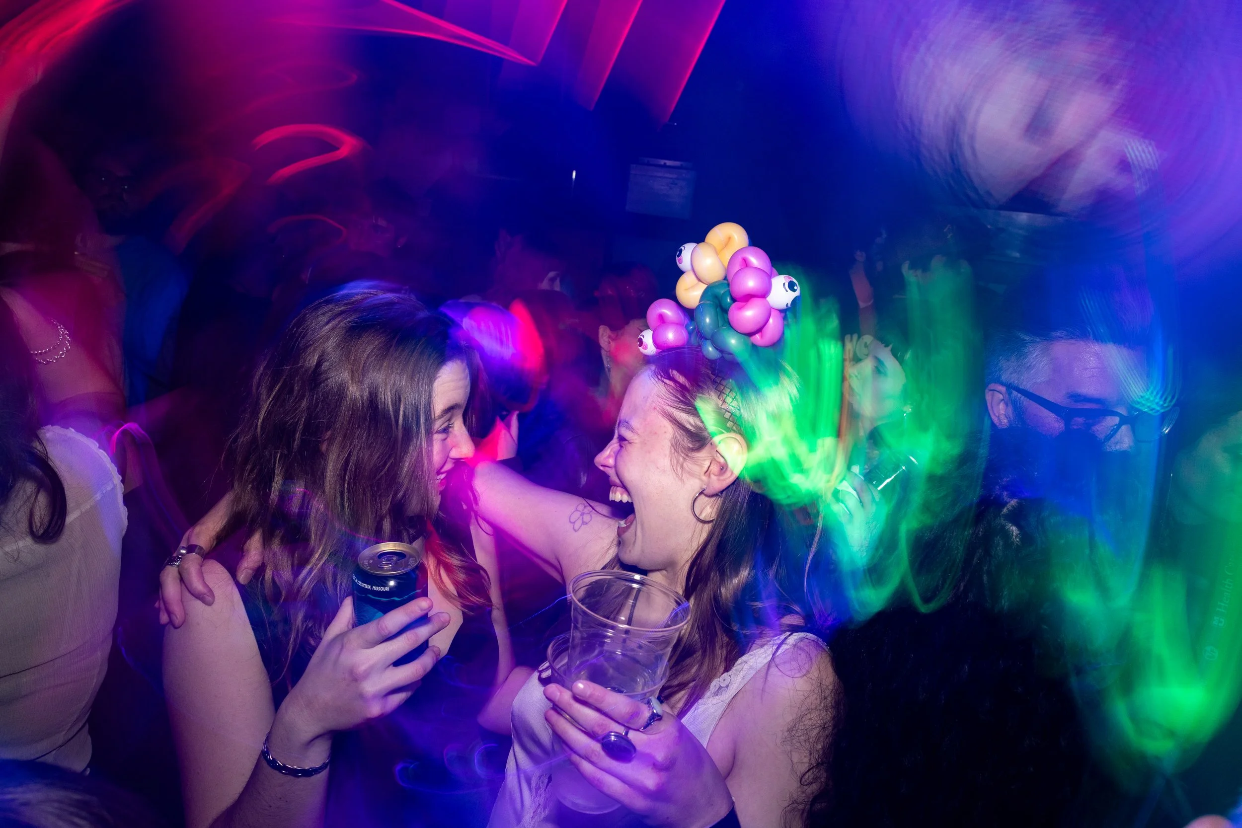 Silvia Stamnaugh, left, and Sophie Kingston laugh and dance into the early morning hours during the True/False Film Festival's @ction Party at the club My House on Feb. 28, 2025 in Columbia, Mo