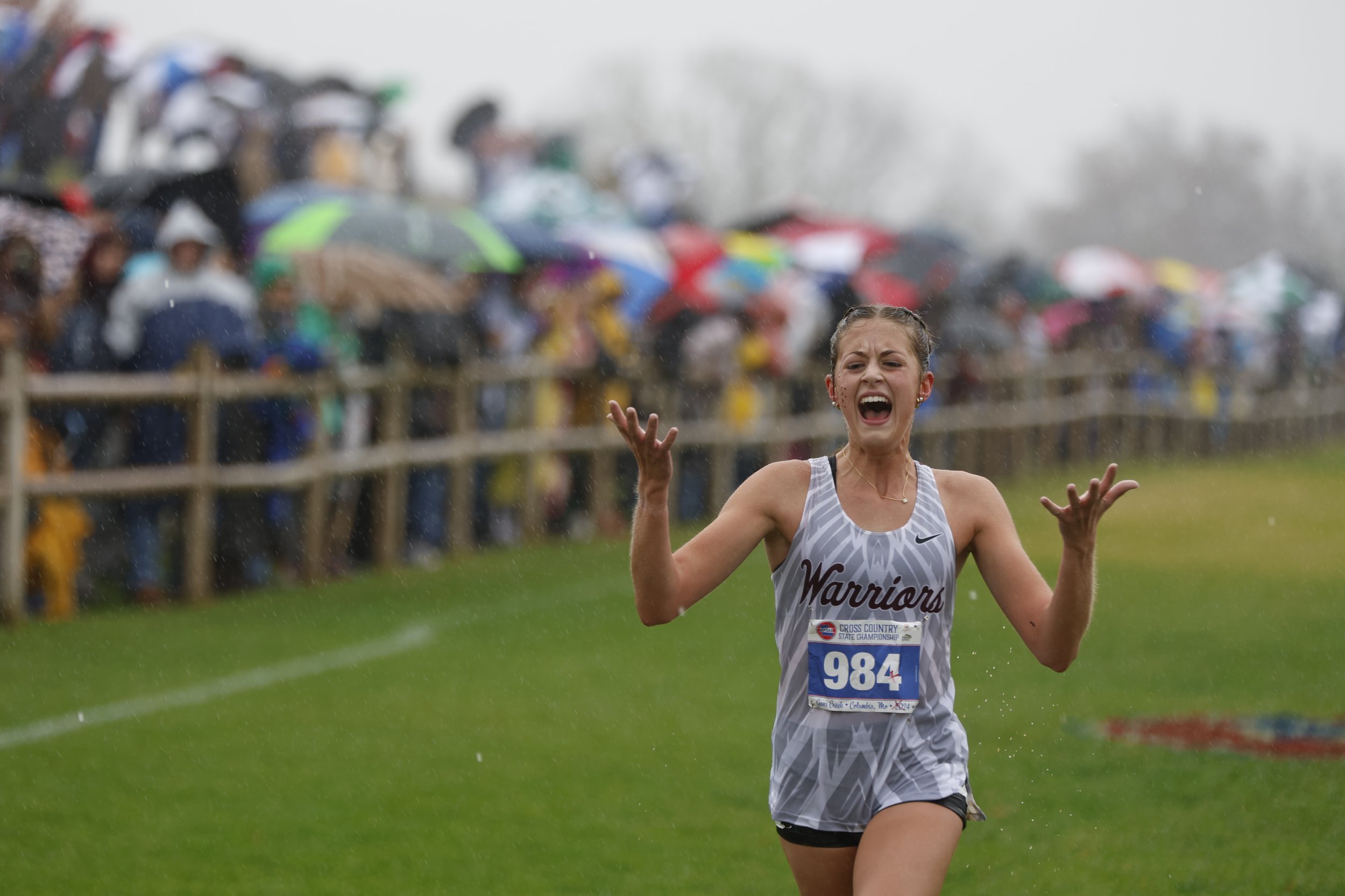 St. Charles West High sophomore Brianna Krueger celebrates as she takes first place in Class 3 of the Missouri State High School Activities Association State Championships cross country meet Nov. 9, 2024, at Gans Creek in Columbia, Mo. Krueger kept a