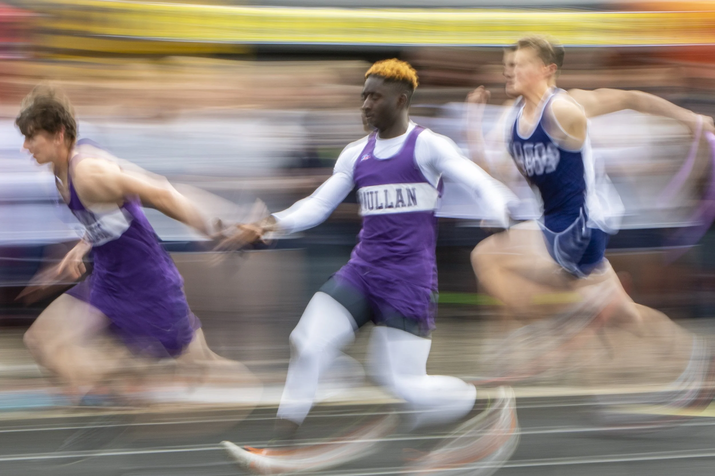 Mullan High sophomore Kofi Appiah, centers hands the baton off to junior Floyd Nelson in the 4x100 meter relay event during the class 1A/2A regional track meet May 14, 2022, at Lapwai Middle/High School in Lapwai, Idaho.