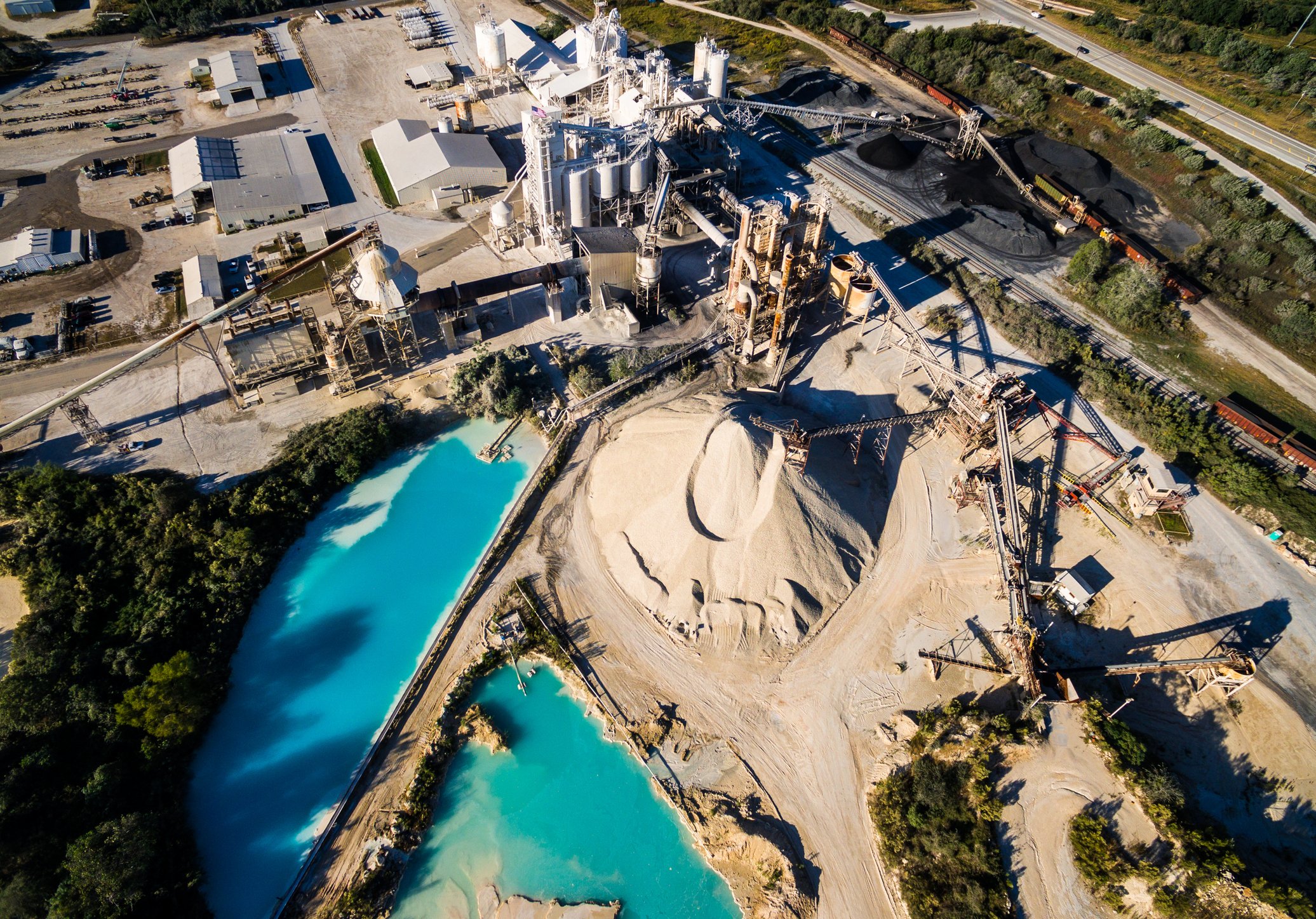 Aerial view of a quarry mining operation illustrating complex assets, infrastructure, and operational considerations involved in transactions