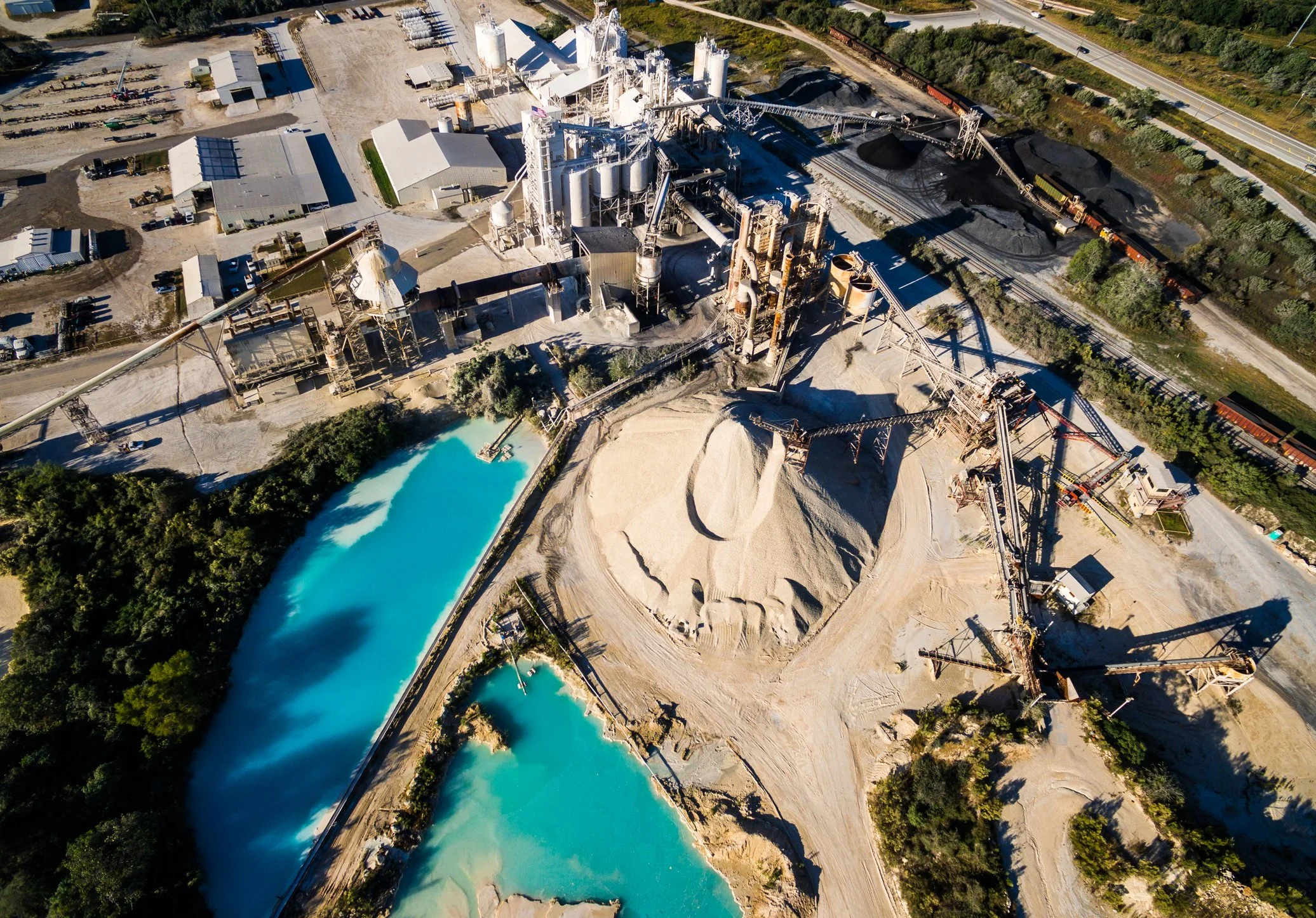 Aerial view of a quarry mining operation illustrating complex assets, infrastructure, and operational considerations involved in transactions