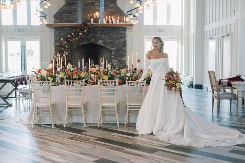 The candlelit head table at The Coach House