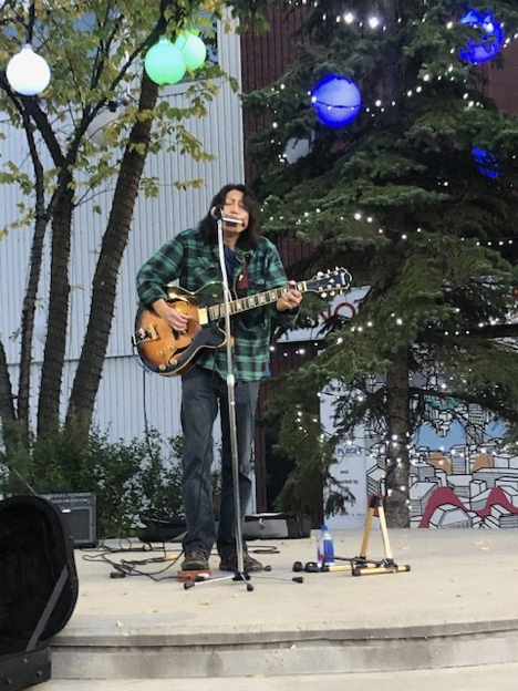 On stage at Edmonton's 124 Street Grand Market summer of 2019. Farmers' markets have a great atmosphere for a performer! 
