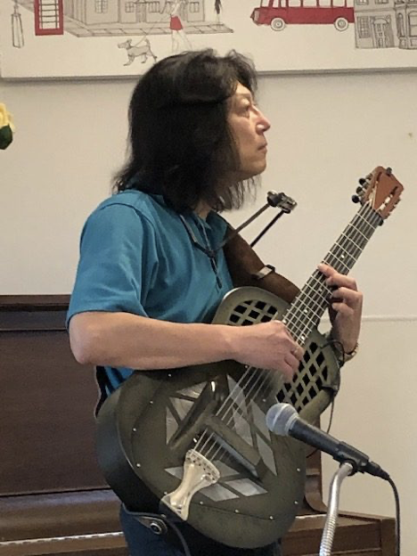One of the many retirement homes that Ryu performs at regularly, South Terrace. Another guitar: a National, which is very unique. Ryu has an appropriate repertoire for the seniors that includes some of the songs from their younger years. 
