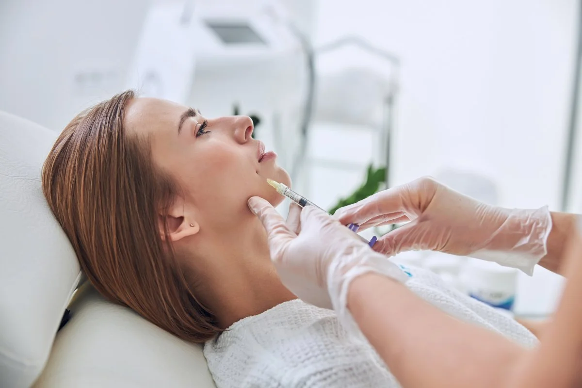 Young woman getting dermal fillers