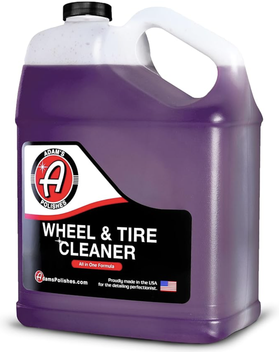 A purple container of Adam's Wheel & Tire Cleaner with a black cap and handle, featuring a label that includes the product name, website, and a small American flag.