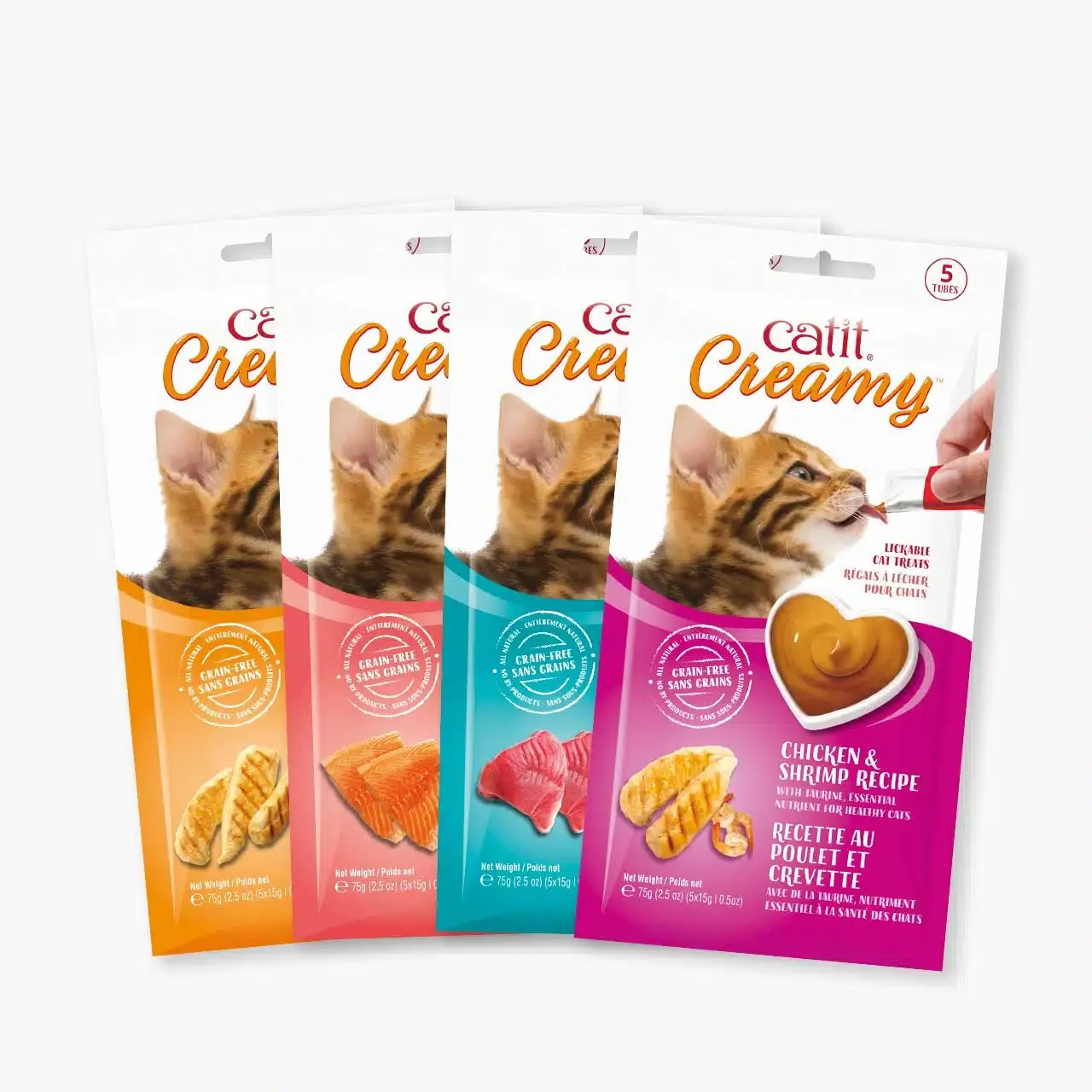 Four packages of Catit Creamy cat treat snacks with a picture of a tabby cat licking a spoonful of treat, each package showing different flavors in orange, pink, blue, and purple packaging.