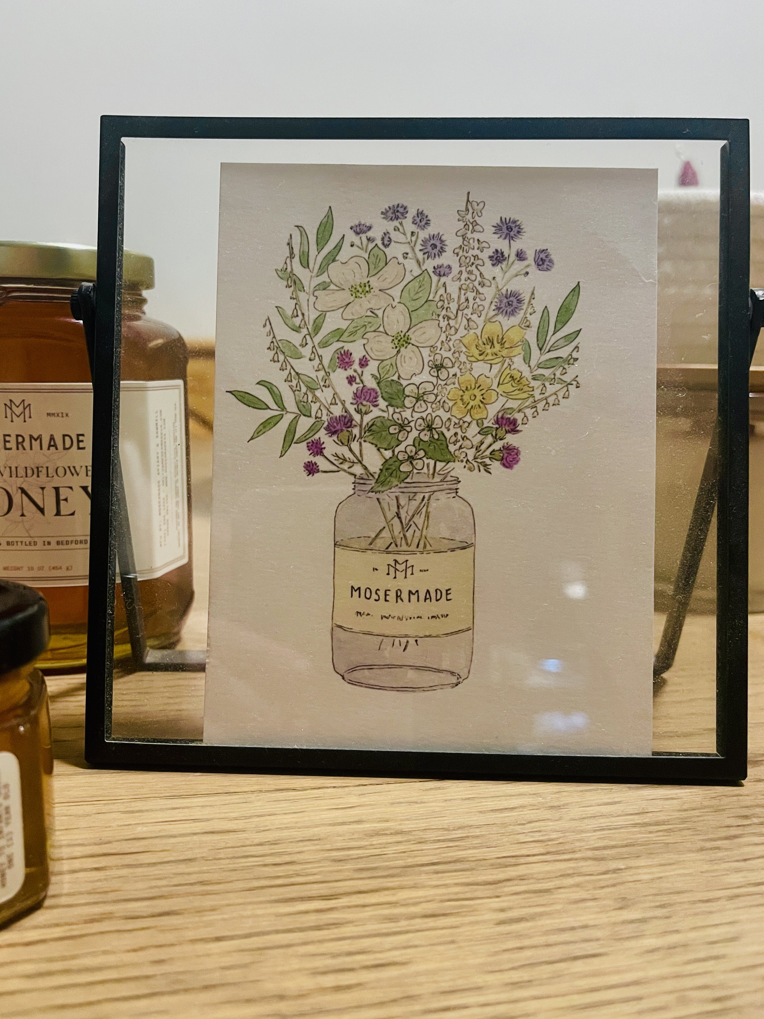 A beautifully rendered watercolor image featuring local VA wildflowers in a mosermade honey jar, capturing the essence of natural elegance.