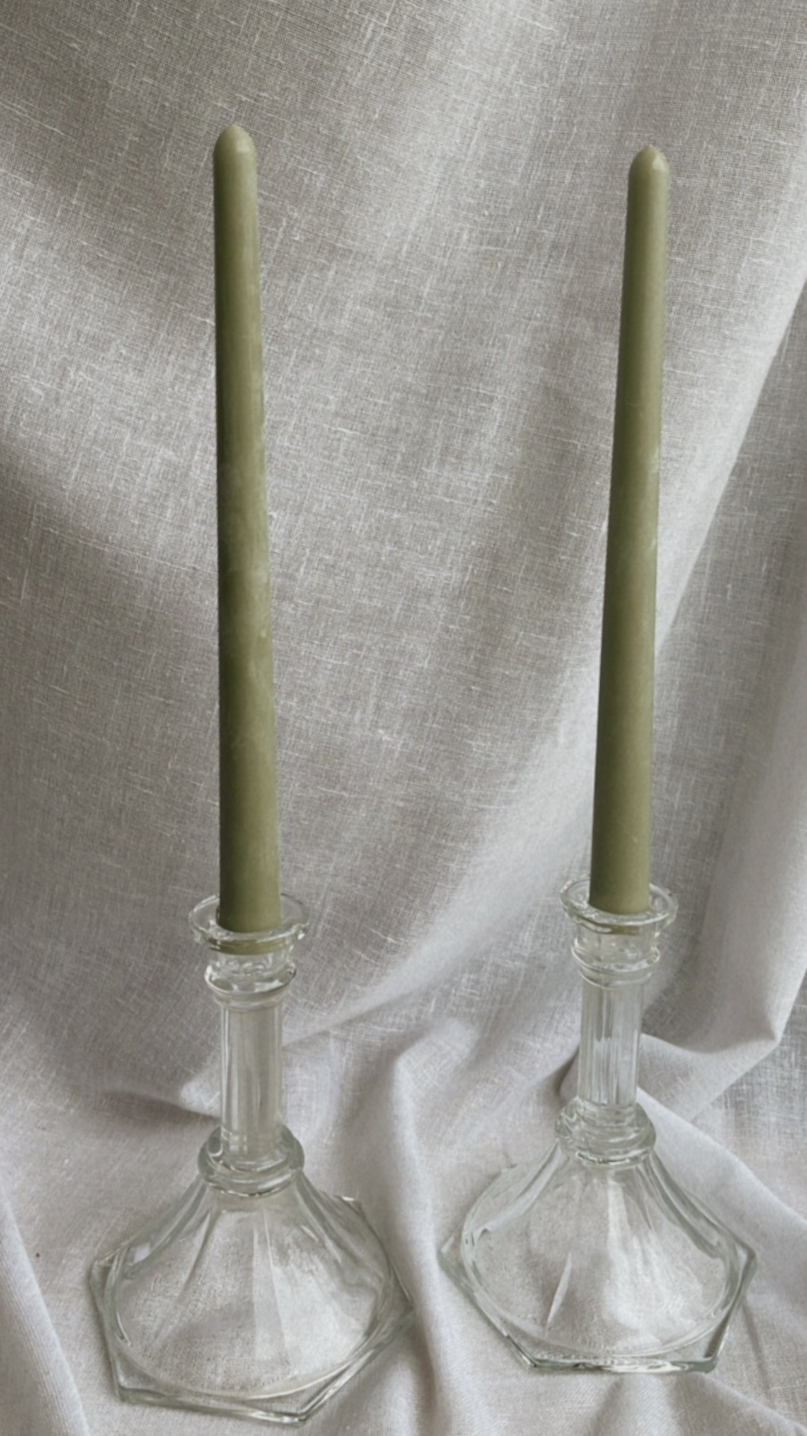 A gorgeous set of vintage crystal glass candlestick holders that bring a timeless elegance into your space.