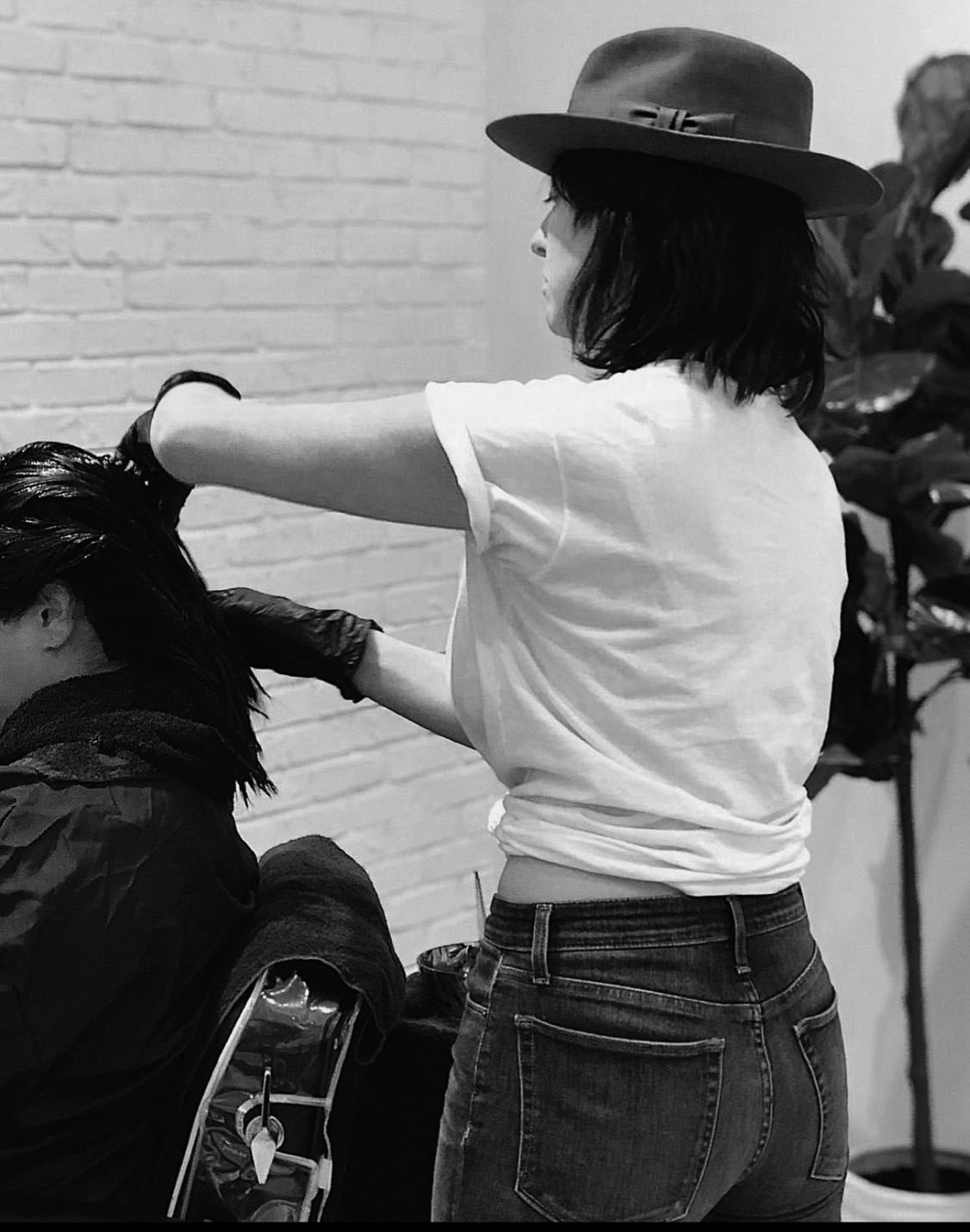 Jenna Giving Haircut Black and White.png