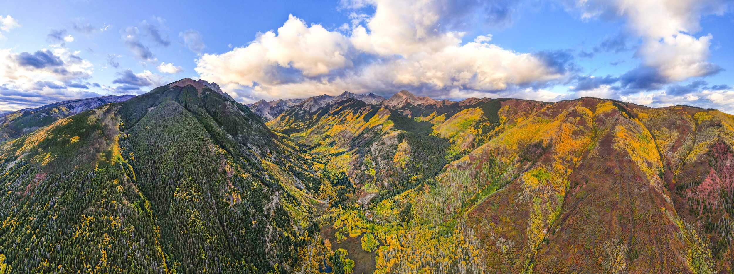 A bird's eye view looks up the valley towards Snowmass Mountain