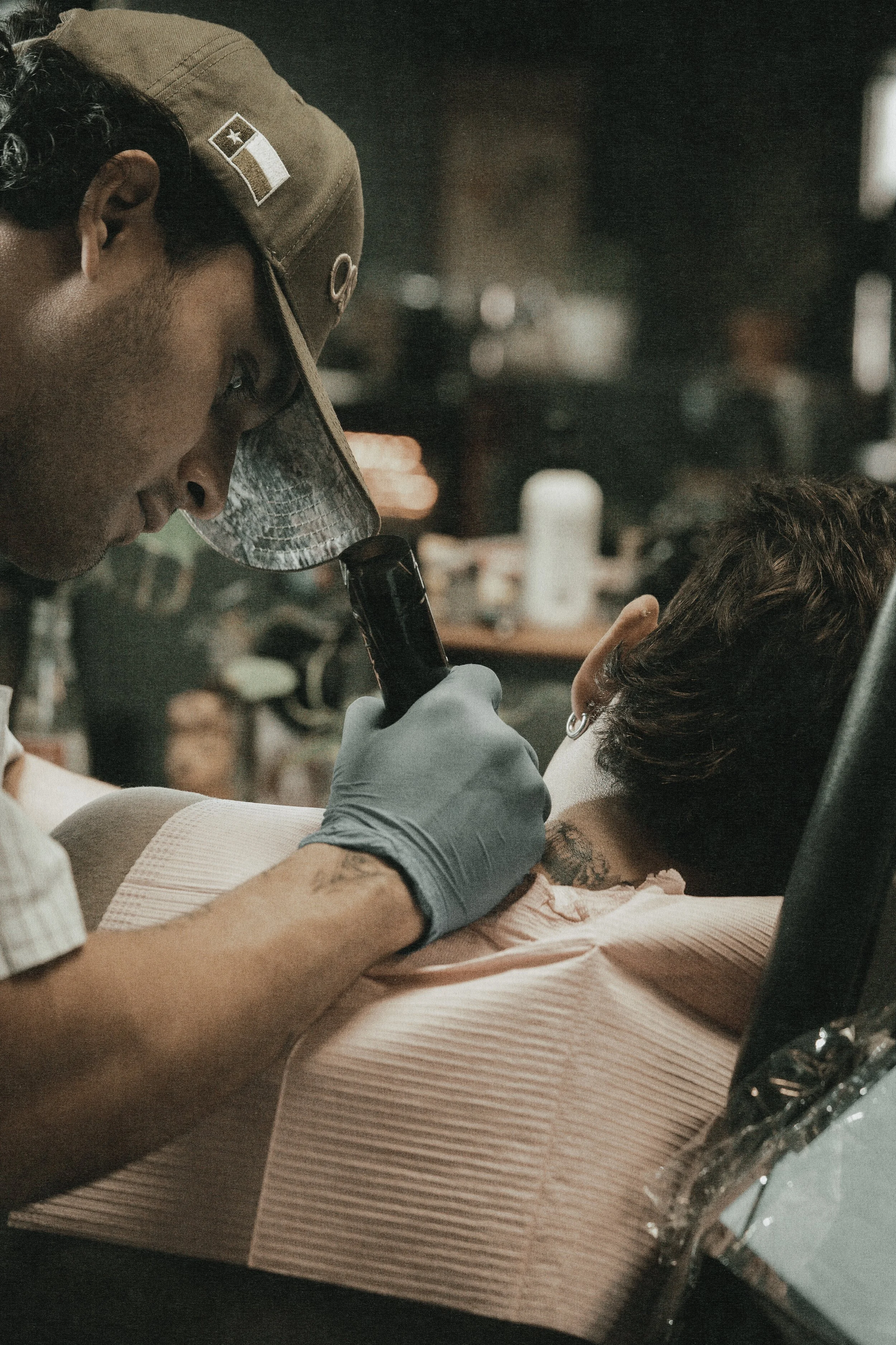 Jon working on a neck tattoo