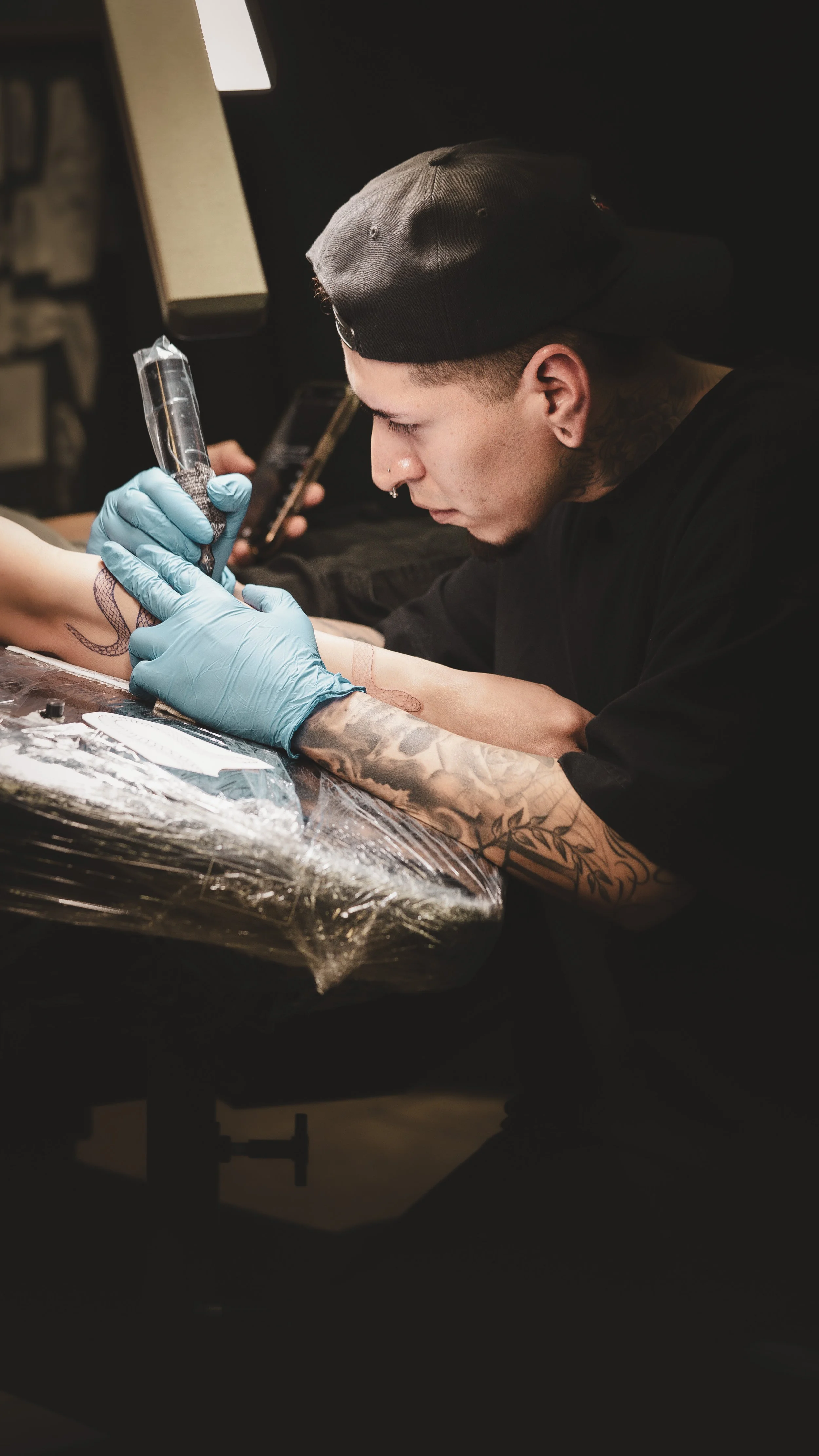 Esteban working on a snake forearm 