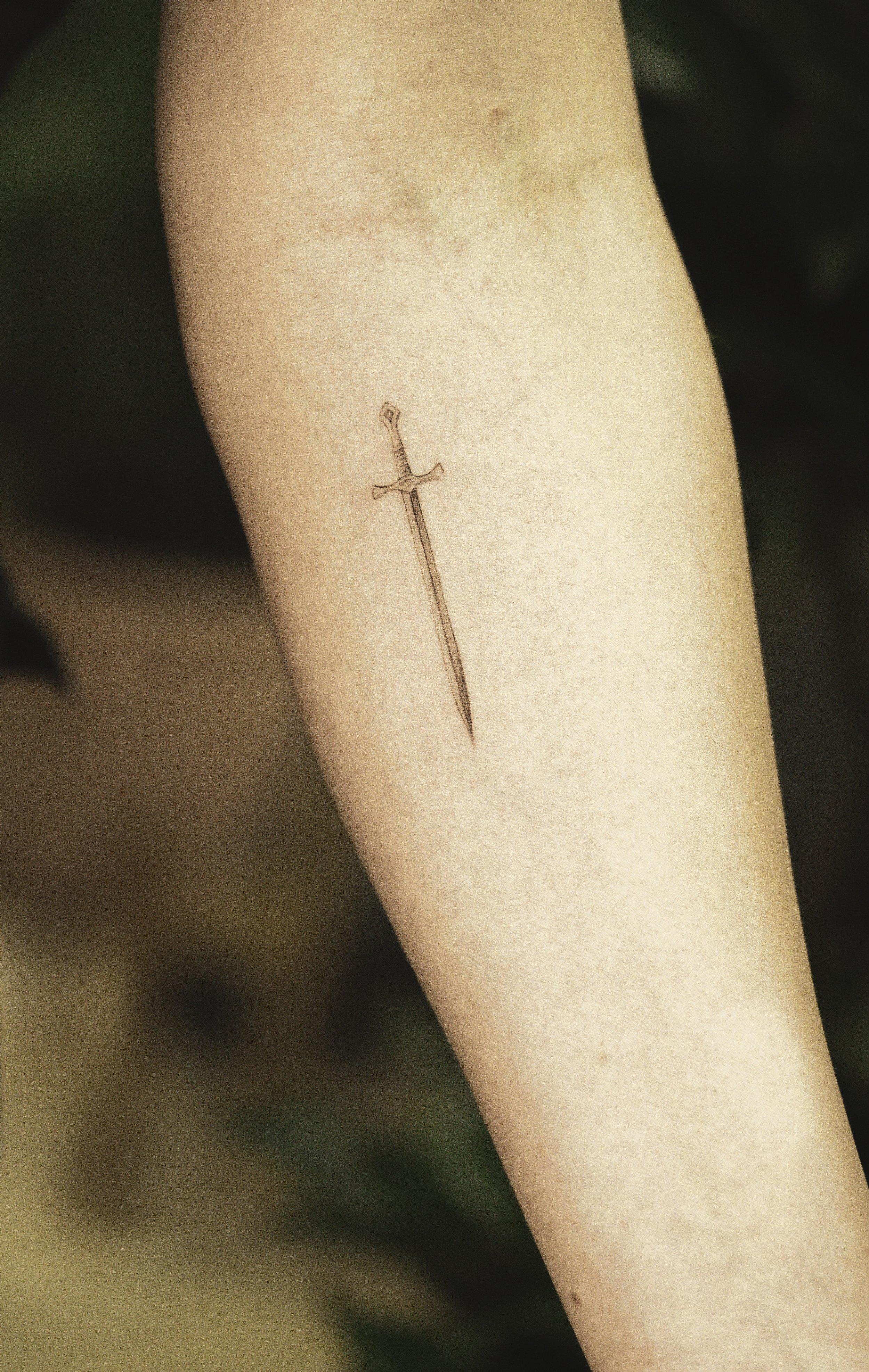 fineline-elpaso-texas-sword-small-tattoo.jpg