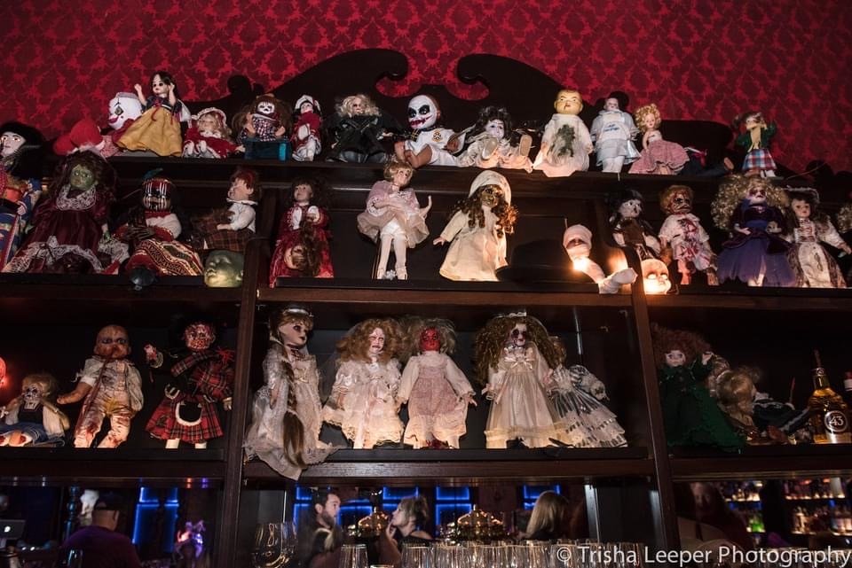Immersive Los Gatos , Themed Bar, a shekf filled with Creepy Dolls that I transformed