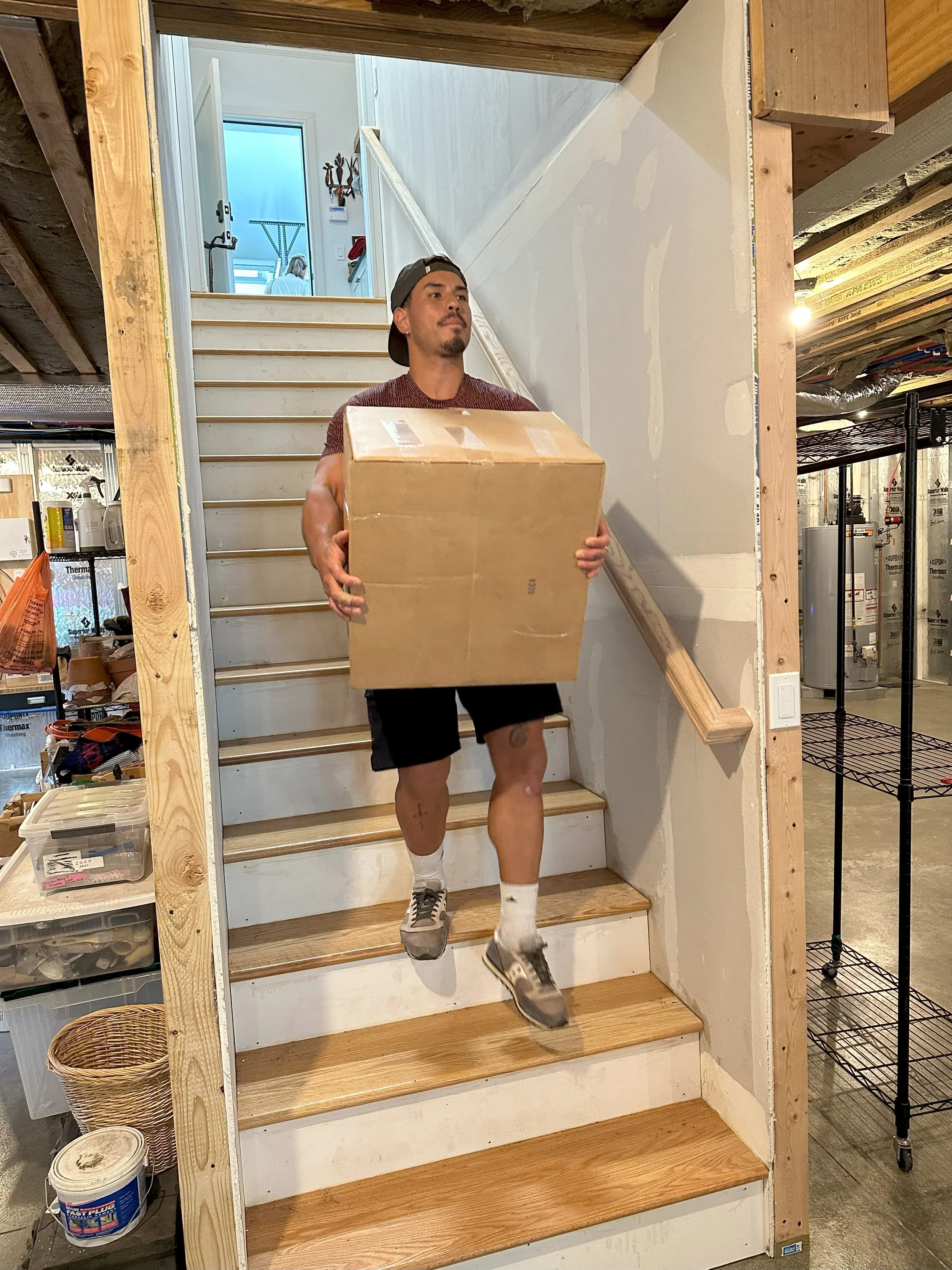 Refresh caught one of our crew members, Aldo, carrying boxes down stairs at a job site.